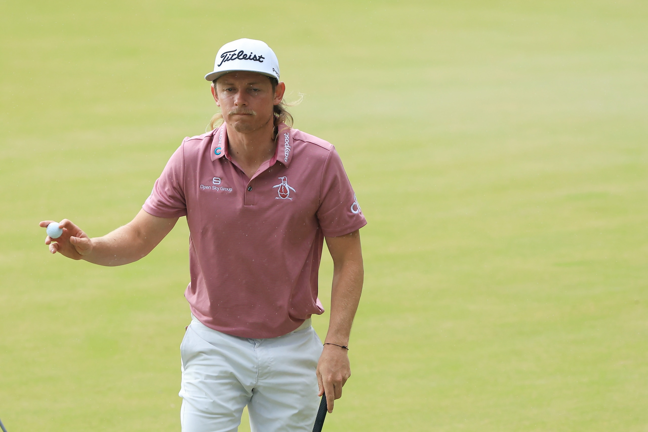 PONTE VEDRA BEACH, FLORIDA - MARCH 14: Cameron Smith of Australia waves on the tenth green during the final round of THE PLAYERS Championship on the Stadium Course at TPC Sawgrass on March 14, 2022 in Ponte Vedra Beach, Florida. (Photo by Sam Greenwood/Getty Images)