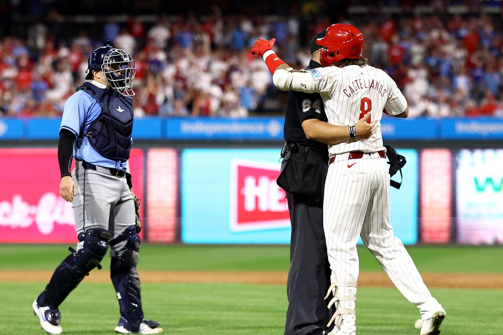 PHILADELPHIA, PENNSYLVANIA - SEPTEMBER 10: Nick Castellanos #8 of the Philadelphia Phillies reacts after being hit by a pitch during the eighth inning against the Tampa Bay Rays at Citizens Bank Park on September 10, 2024 in Philadelphia, Pennsylvania. (Photo by Tim Nwachukwu/Getty Images)
