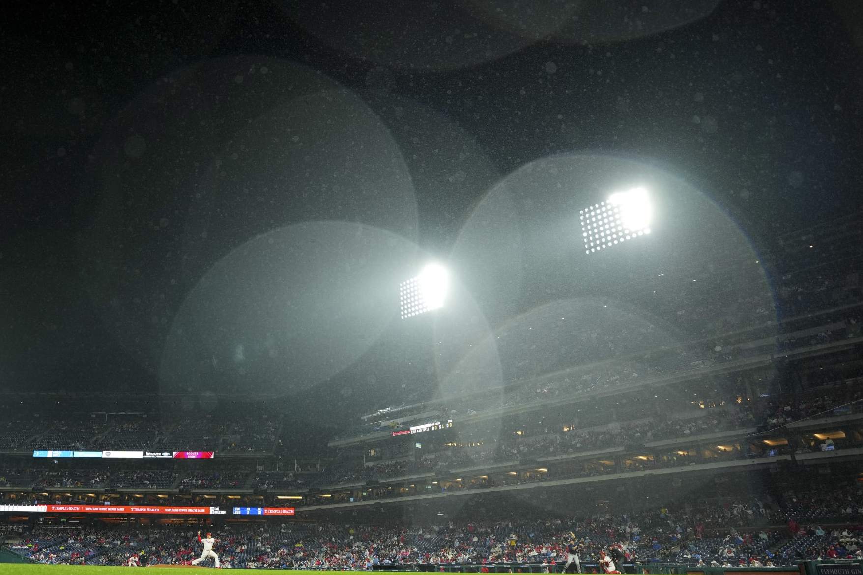 Phillies fan carted off field after falling into bullpen