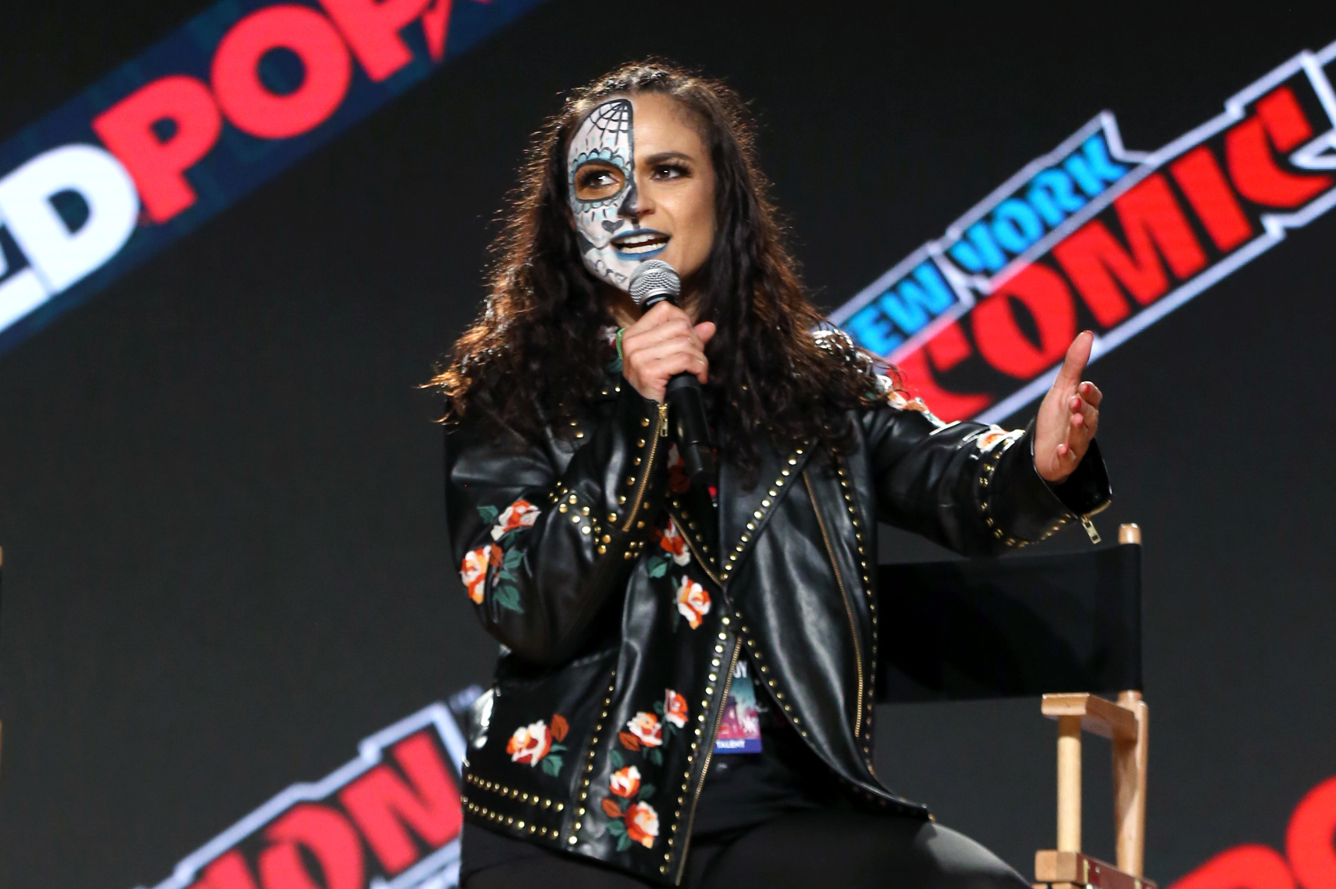 NEW YORK, NEW YORK - OCTOBER 09: Thunder Rosa speaks on stage during the All Elite Wrestling Invades New York Comic Con panel during Day 3 of New York Comic Con 2021 at Jacob Javits Center on October 09, 2021 in New York City. (Photo by Bennett Raglin/Getty Images for ReedPop)