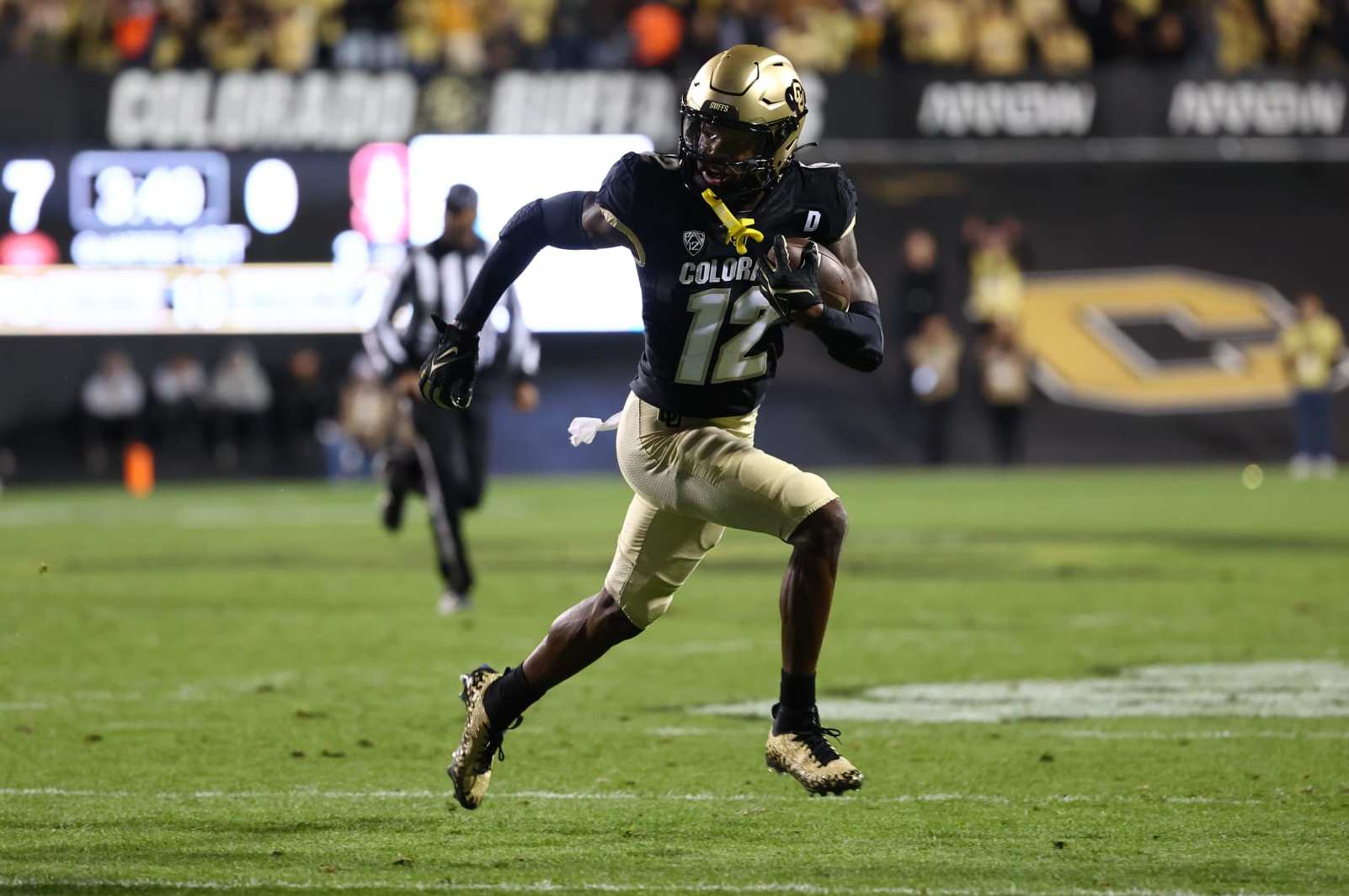 College Football: Colorado receiver Travis Hunter 12) in action, runs with the football vs Stanford at Folsom Field. 
Boulder, CO 10/13/2023 
CREDIT: Jamie Schwaberow (Photo by Jamie Schwaberow/Sports Illustrated via Getty Images) 
(Set Number: X164442)
