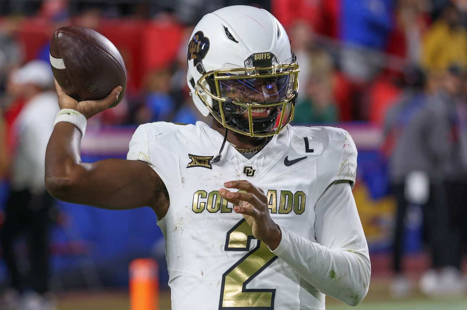 KANSAS CITY, MO - NOVEMBER 23: Colorado Buffaloes quarterback Shedeur Sanders (2) throws a warm up pass between series in the fourth quarter of a Big 12 game between the Colorado Buffaloes and Kansas Jayhawks on November 23, 2024 at GEHA Field at Arrowhead Stadium in Kansas City, MO. (Photo by Scott Winters/Icon Sportswire via Getty Images)