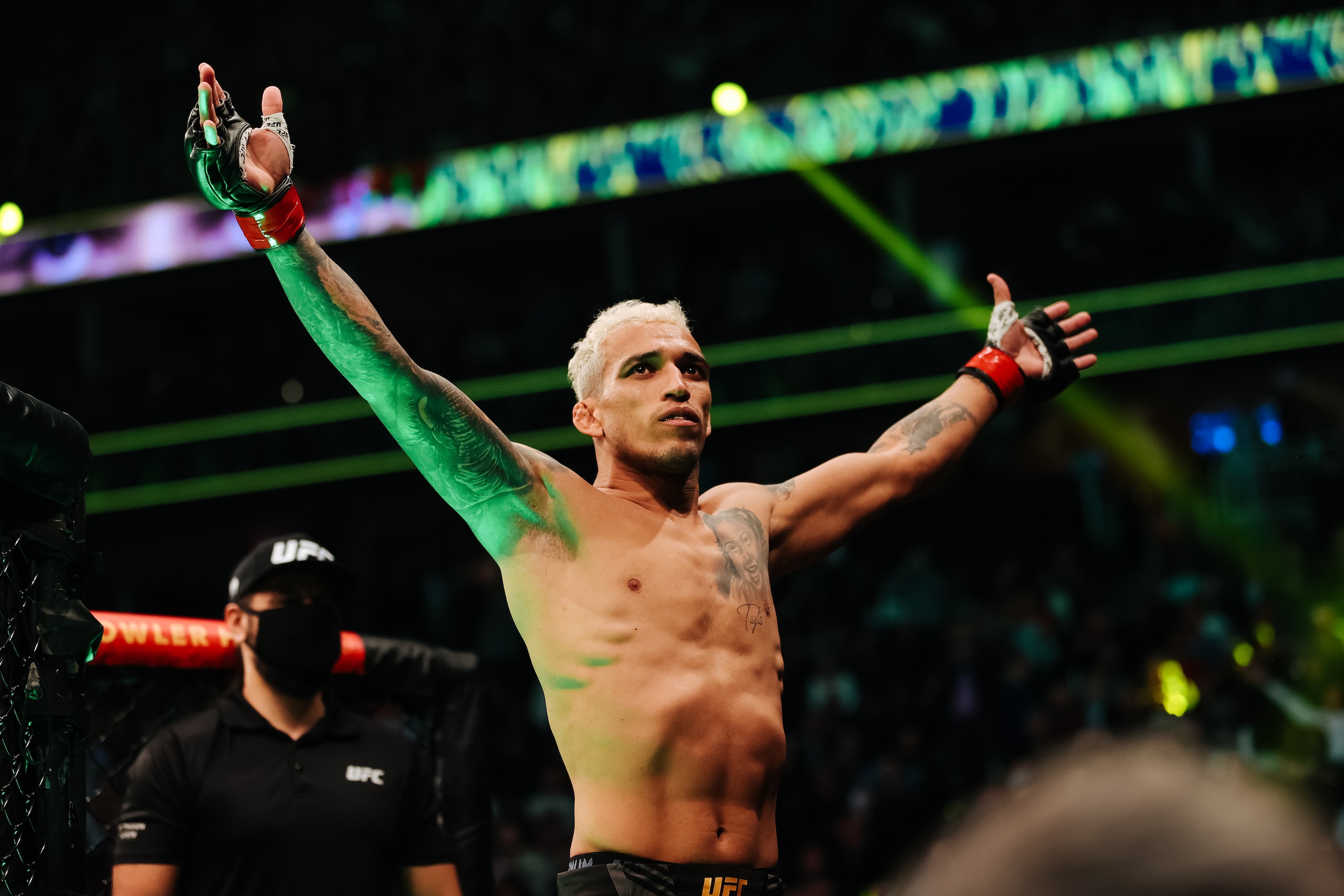 LAS VEGAS, NEVADA - DECEMBER 11: Charles Oliveira of Brazil enters the octagon for his lightweight title fight against Dustin Poirier during the UFC 269 event at T-Mobile Arena on December 11, 2021 in Las Vegas, Nevada. (Photo by Carmen Mandato/Getty Images)