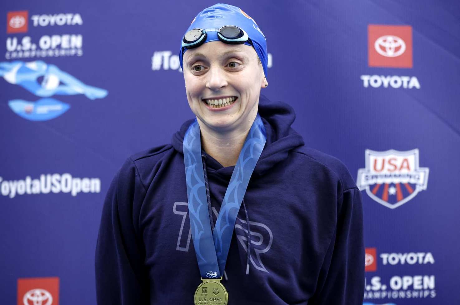 GREENSBORO, NORTH CAROLINA - DECEMBER 03: Katie Ledecky poses with her medal after winning the Women's 1500m Freestyle Final during the Toyota U.S. Open Championships at Greensboro Aquatic Center on December 03, 2022 in Greensboro, North Carolina. (Photo by Jared C. Tilton/Getty Images)