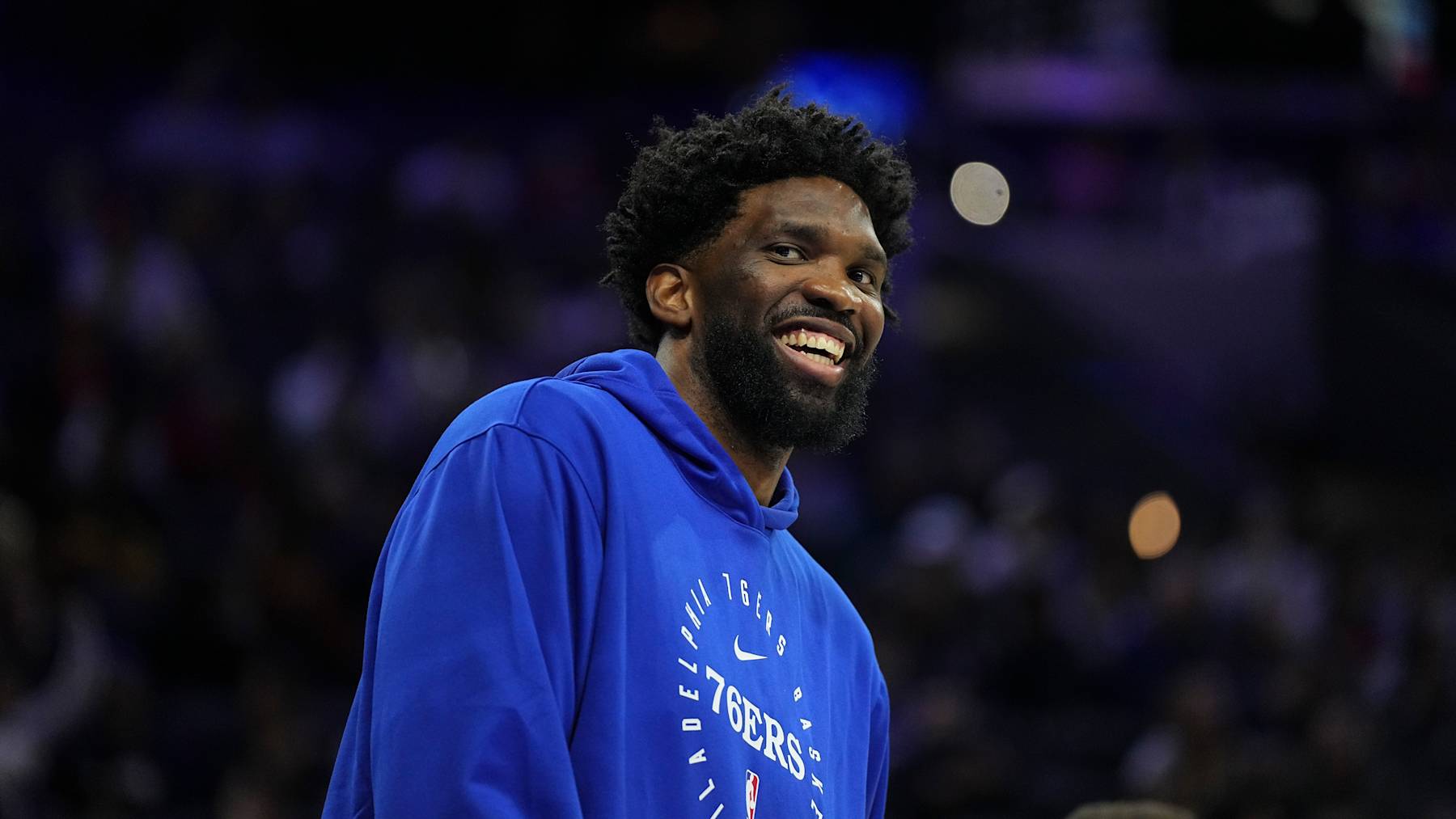 PHILADELPHIA, PENNSYLVANIA - OCTOBER 16: Joel Embiid #21 of the Philadelphia 76ers smiles against the Brooklyn Nets in the first half of the preseason game at the Wells Fargo Center on October 16, 2024 in Philadelphia, Pennsylvania. NOTE TO USER: User expressly acknowledges and agrees that, by downloading and/or using this photograph, user is consenting to the terms and conditions of the Getty Images License Agreement. (Photo by Mitchell Leff/Getty Images)