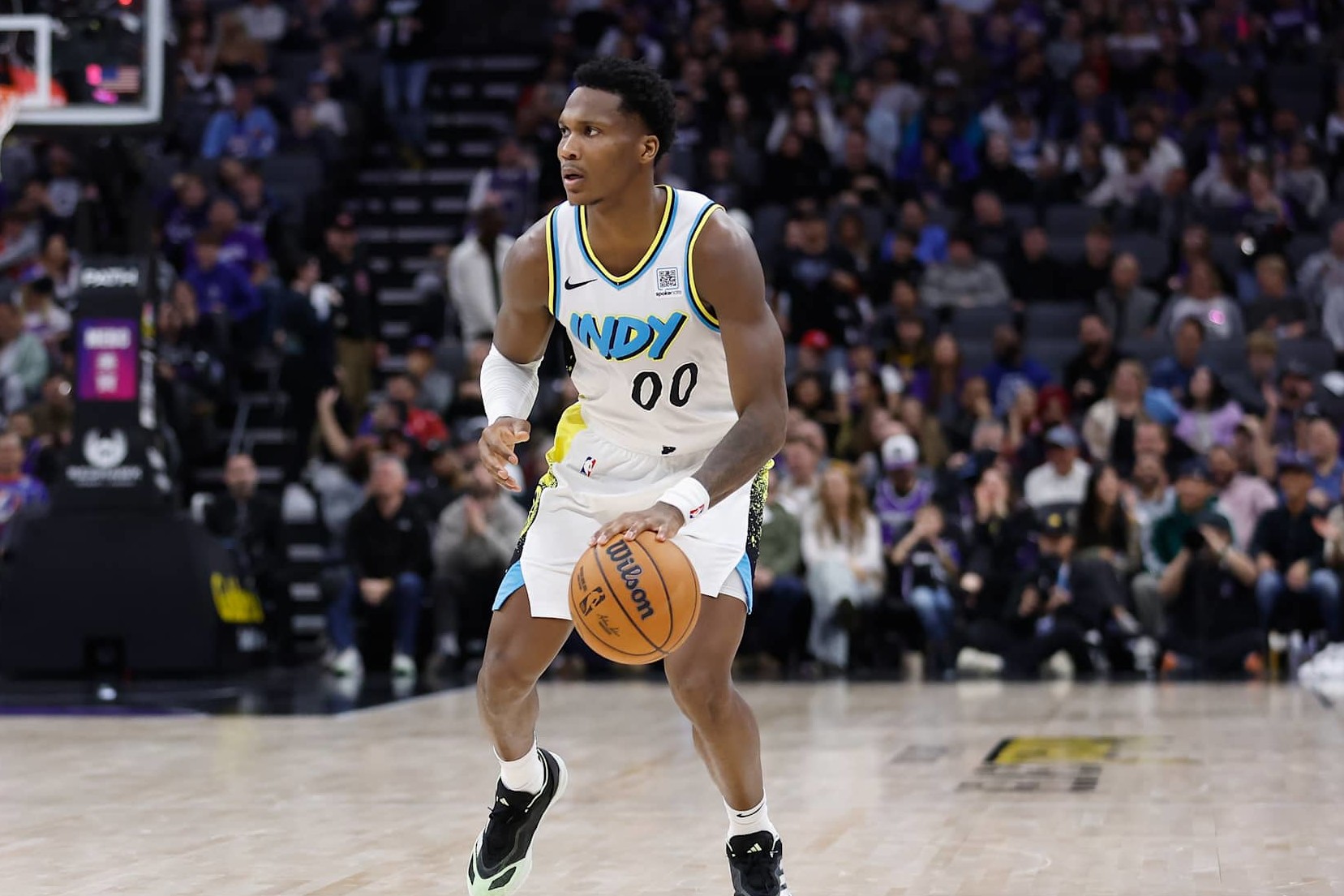 SACRAMENTO, CALIFORNIA - DECEMBER 22: Bennedict Mathurin #00 of the Indiana Pacers dribbles the ball in the second quarter against the Sacramento Kings at Golden 1 Center on December 22, 2024 in Sacramento, California. NOTE TO USER: User expressly acknowledges and agrees that, by downloading and or using this photograph, User is consenting to the terms and conditions of the Getty Images License Agreement. (Photo by Lachlan Cunningham/Getty Images)