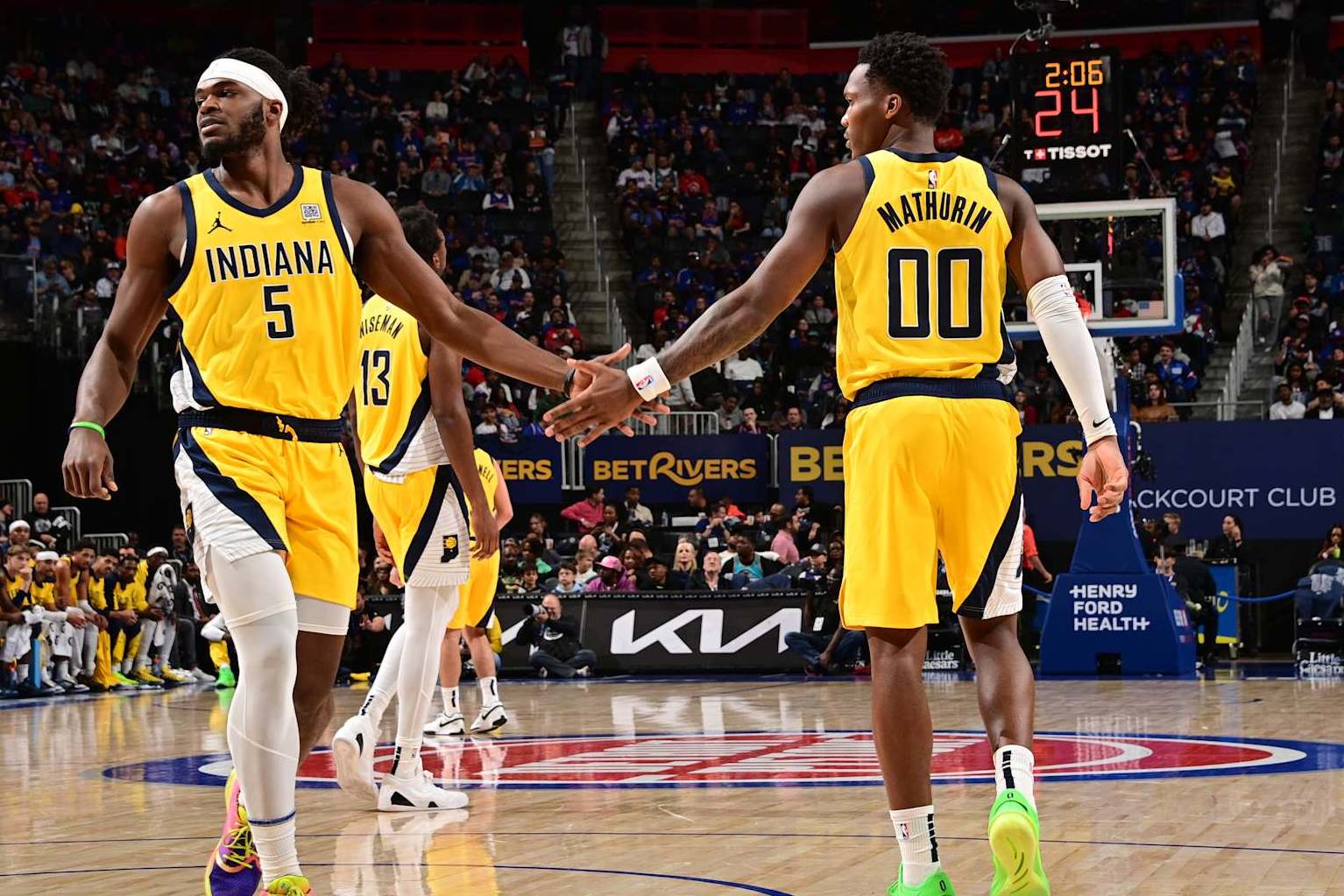 DETROIT, MI - OCTOBER 23: Jarace Walker #5 and Bennedict Mathurin #00 of the Indiana Pacers high five during the game against the Detroit Pistons on October 23, 2024 at Little Caesars Arena in Detroit, Michigan. NOTE TO USER: User expressly acknowledges and agrees that, by downloading and/or using this photograph, User is consenting to the terms and conditions of the Getty Images License Agreement. Mandatory Copyright Notice: Copyright 2024 NBAE (Photo by Chris Schwegler/NBAE via Getty Images)
