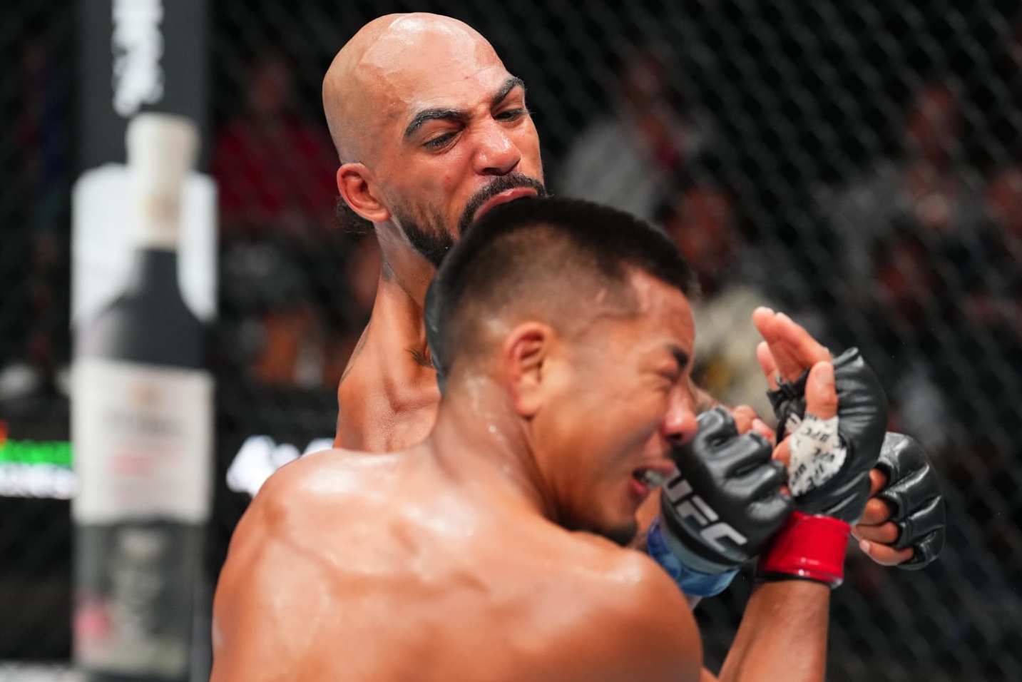 DENVER, COLORADO - JULY 13: Charles Johnson punches Joshua Van of Myanmar in a flyweight fight during the UFC Fight Night event at Ball Arena on July 13, 2024 in Denver, Colorado. (Photo by Josh Hedges/Zuffa LLC via Getty Images)
