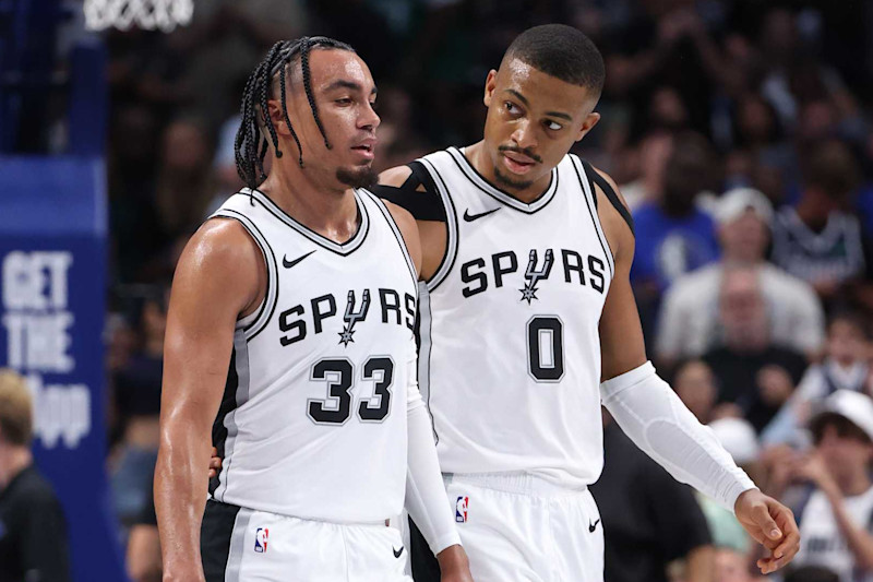 DALLAS, TX - OCTOBER 24: Tre Jones #33 and Keldon Johnson #0 of the San Antonio Spurs look on during the game against the Dallas Mavericks on October 24, 2024 at American Airlines Center in Dallas, Texas. NOTE TO USER: User expressly acknowledges and agrees that, by downloading and or using this photograph, User is consenting to the terms and conditions of the Getty Images License Agreement. Mandatory Copyright Notice: Copyright 2024 NBAE (Photo by Joe Murphy/NBAE via Getty Images)