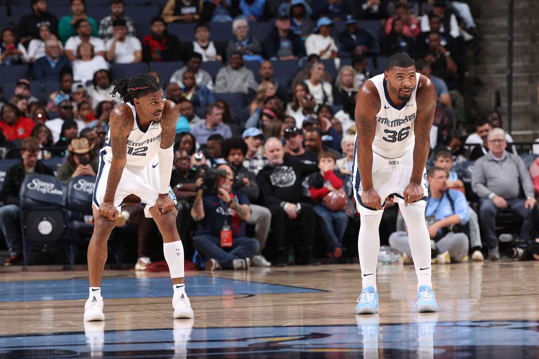 MEMPHIS, TN - OCTOBER 18: Ja Morant #12 and Marcus Smart #36 of the Memphis Grizzlies look on during the game against the Miami Heat during a NBA pre season game on October 18, 2024 at FedExForum in Memphis, Tennessee. NOTE TO USER: User expressly acknowledges and agrees that, by downloading and or using this photograph, User is consenting to the terms and conditions of the Getty Images License Agreement. Mandatory Copyright Notice: Copyright 2024 NBAE (Photo by Joe Murphy/NBAE via Getty Images)