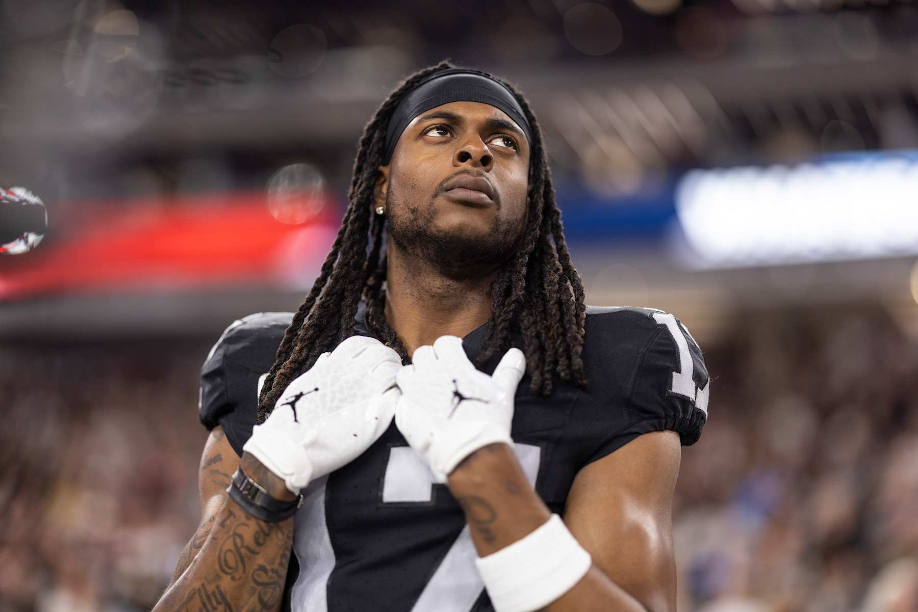 LAS VEGAS, NEVADA - DECEMBER 14: Davante Adams #17 of the Las Vegas Raiders looks on during the national anthem prior to an NFL football game between the Las Vegas Raiders and the Los Angeles Chargers at Allegiant Stadium on December 14, 2023 in Las Vegas, Nevada. (Photo by Michael Owens/Getty Images) LAS VEGAS, NEVADA - DECEMBER 14: Davante Adams #17 of the Las Vegas Raiders looks on during the national anthem prior to an NFL football game between the Las Vegas Raiders and the Los Angeles Chargers at Allegiant Stadium on December 14, 2023 in Las Vegas, Nevada. (Photo by Michael Owens/Getty Images)