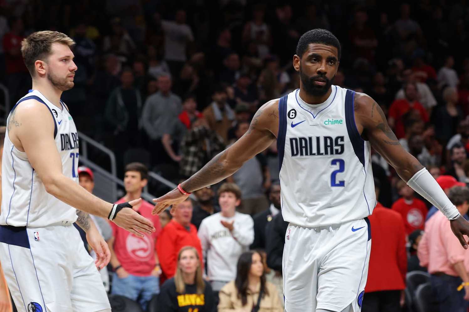 ATLANTA, GEORGIA - APRIL 02: Luka Doncic #77 and Kyrie Irving #2 of the Dallas Mavericks react against the Atlanta Hawks during the fourth quarter at State Farm Arena on April 02, 2023 in Atlanta, Georgia. NOTE TO USER: User expressly acknowledges and agrees that, by downloading and or using this photograph, User is consenting to the terms and conditions of the Getty Images License Agreement. (Photo by Kevin C. Cox/Getty Images) ATLANTA, GEORGIA - APRIL 02: Luka Doncic #77 and Kyrie Irving #2 of the Dallas Mavericks react against the Atlanta Hawks during the fourth quarter at State Farm Arena on April 02, 2023 in Atlanta, Georgia. NOTE TO USER: User expressly acknowledges and agrees that, by downloading and or using this photograph, User is consenting to the terms and conditions of the Getty Images License Agreement. (Photo by Kevin C. Cox/Getty Images)