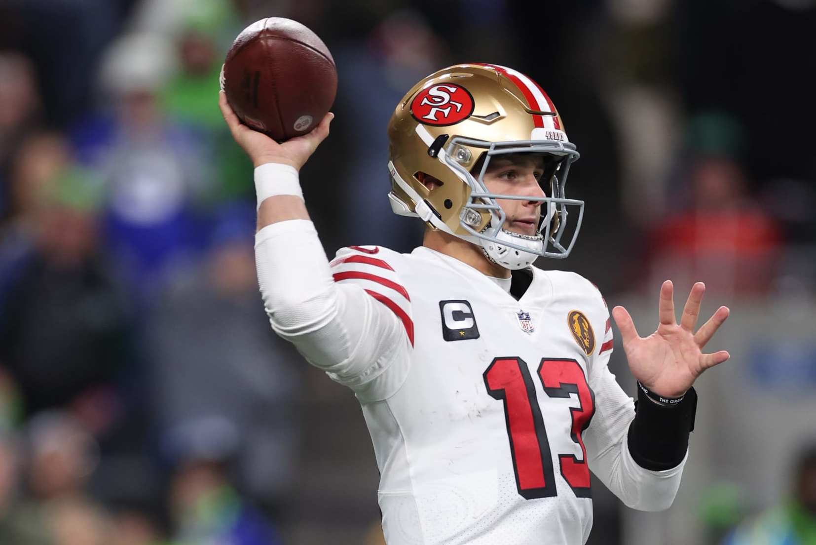 SEATTLE, WASHINGTON - NOVEMBER 23: Brock Purdy #13 of the San Francisco 49ers throws a pass during the third quarter against the Seattle Seahawks at Lumen Field on November 23, 2023 in Seattle, Washington. (Photo by Steph Chambers/Getty Images)