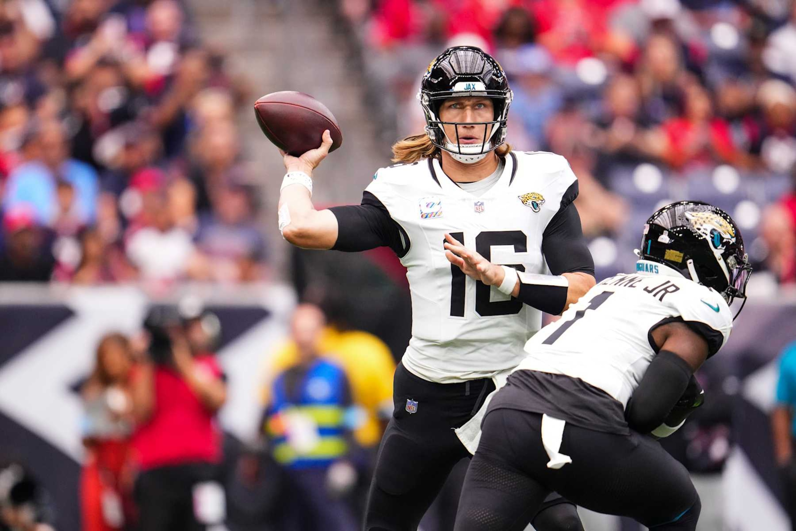 HOUSTON, TX - SEPTEMBER 29: Trevor Lawrence #16 of the Jacksonville Jaguars throws the ball during an NFL football game against the Houston Texans at NRG Stadium on September 29, 2024 in Houston, Texas. (Photo by Cooper Neill/Getty Images)