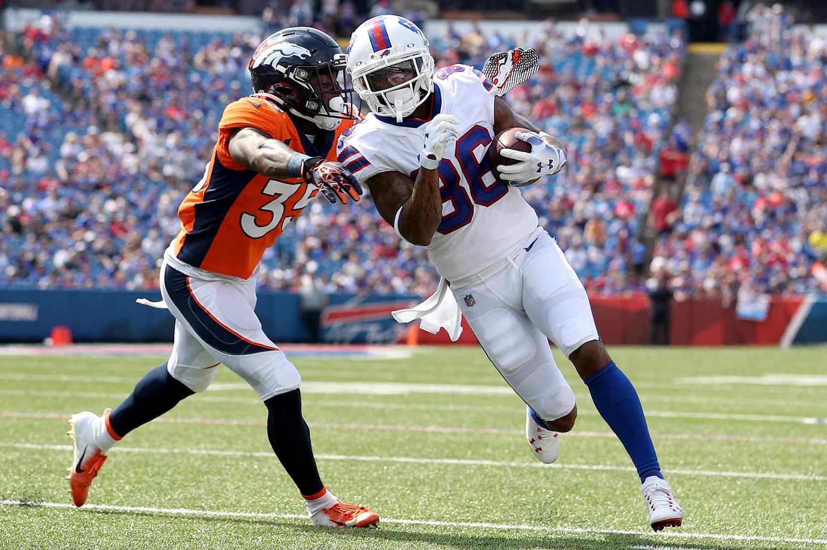 ORCHARD PARK, NEW YORK - AUGUST 20: Ja'Quan McMillian #35 of the Denver Broncos tackles Tavon Austin #86 of the Buffalo Bills during the third quarter of a preseason game at Highmark Stadium on August 20, 2022 in Orchard Park, New York. (Photo by Bryan M. Bennett/Getty Images)