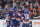 Fans watch New York Islanders' Brock Nelson, second from right celebrates with teammates after scoring a goal during the second period of Game 6 during an NHL hockey second-round playoff series against the Boston Bruins Wednesday, June 9, 2021, in Uniondale, N.Y. (AP Photo/Frank Franklin II)