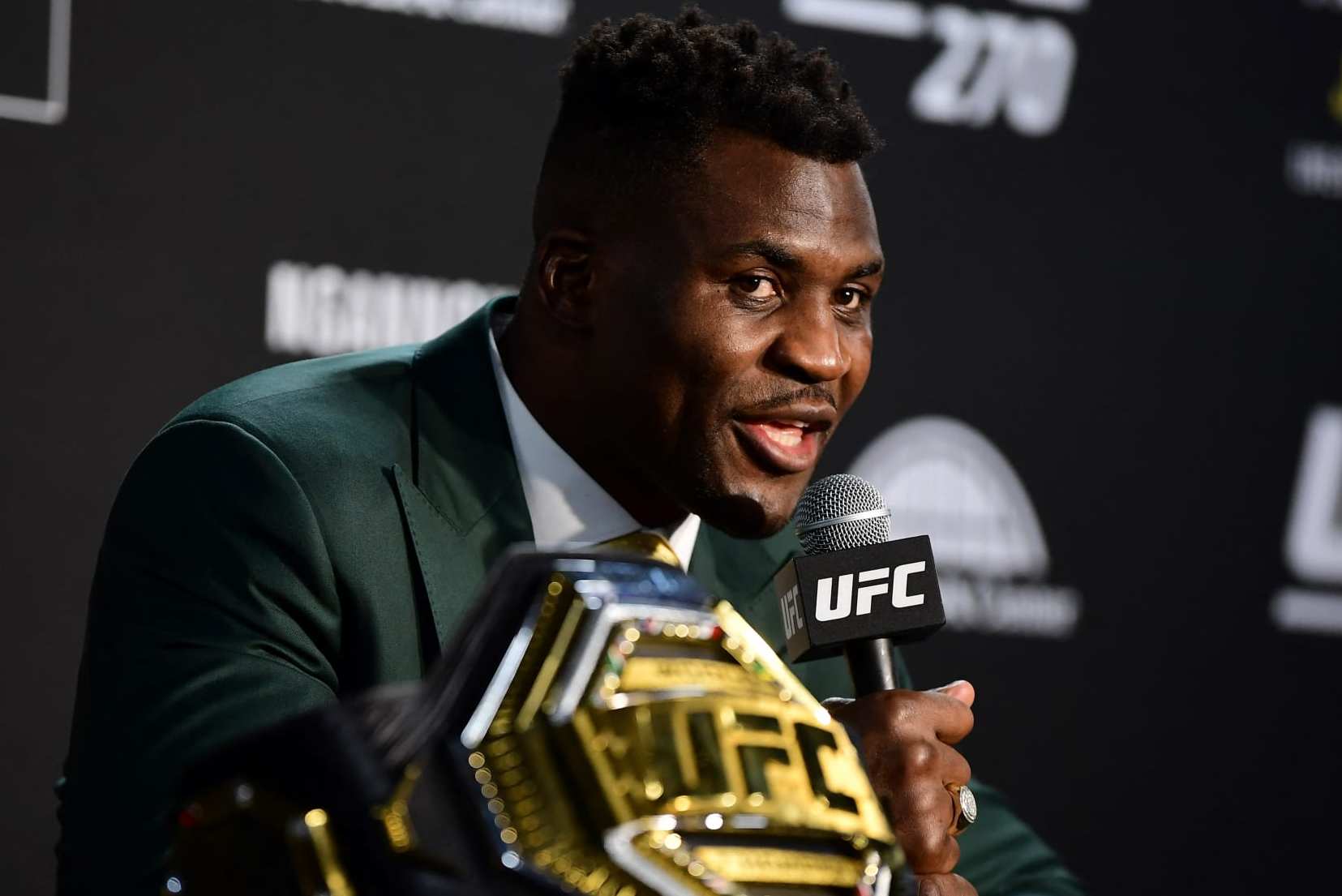 Champion Cameroon's Francis Ngannou takes questions in the press room after defeating French Ciryl Gane in their UFC 270 championship fight in Anaheim on January 22, 2022. (Photo by Frederic J. BROWN / AFP) (Photo by FREDERIC J. BROWN/AFP via Getty Images)