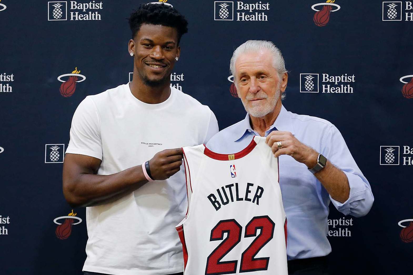 MIAMI, FLORIDA - SEPTEMBER 27:  Jimmy Butler #22 of the Miami Heat poses for a photo with president Pat Riley during his introductory press conference at American Airlines Arena on September 27, 2019 in Miami, Florida. NOTE TO USER: User expressly acknowledges and agrees that, by downloading and or using this photograph, User is consenting to the terms and conditions of the Getty Images License Agreement.  (Photo by Michael Reaves/Getty Images)