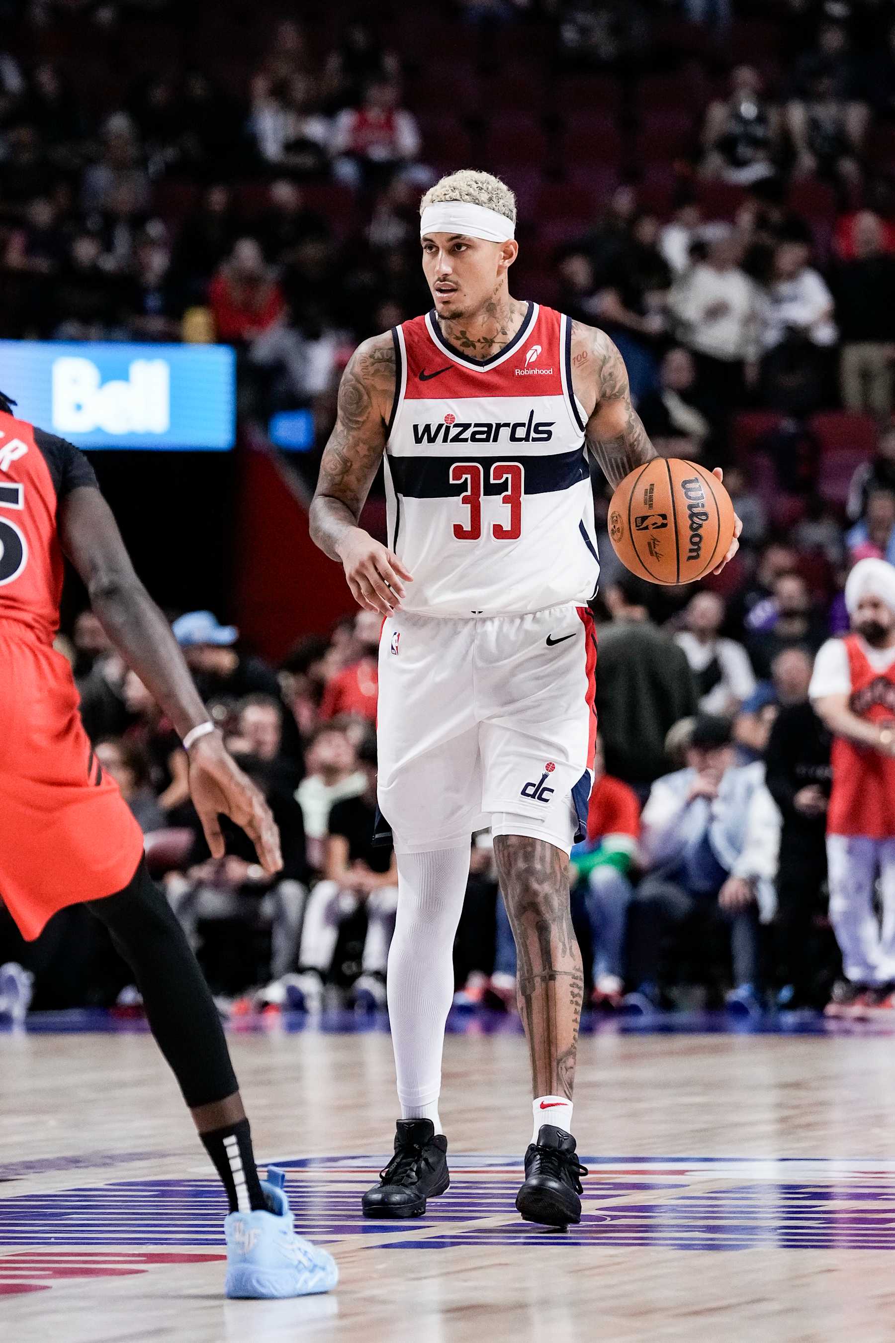 MONTREAL, CANADA - OCTOBER 6:  Kyle Kuzma #33 of the Washington Wizards dribbles the ball during the game against the Toronto Raptors on October 6, 2024 at the Bell Centre in Montreal, Quebec, Canada.  NOTE TO USER: User expressly acknowledges and agrees that, by downloading and or using this Photograph, user is consenting to the terms and conditions of the Getty Images License Agreement.  Mandatory Copyright Notice: Copyright 2024 NBAE (Photo by Jordan Jones/NBAE via Getty Images)