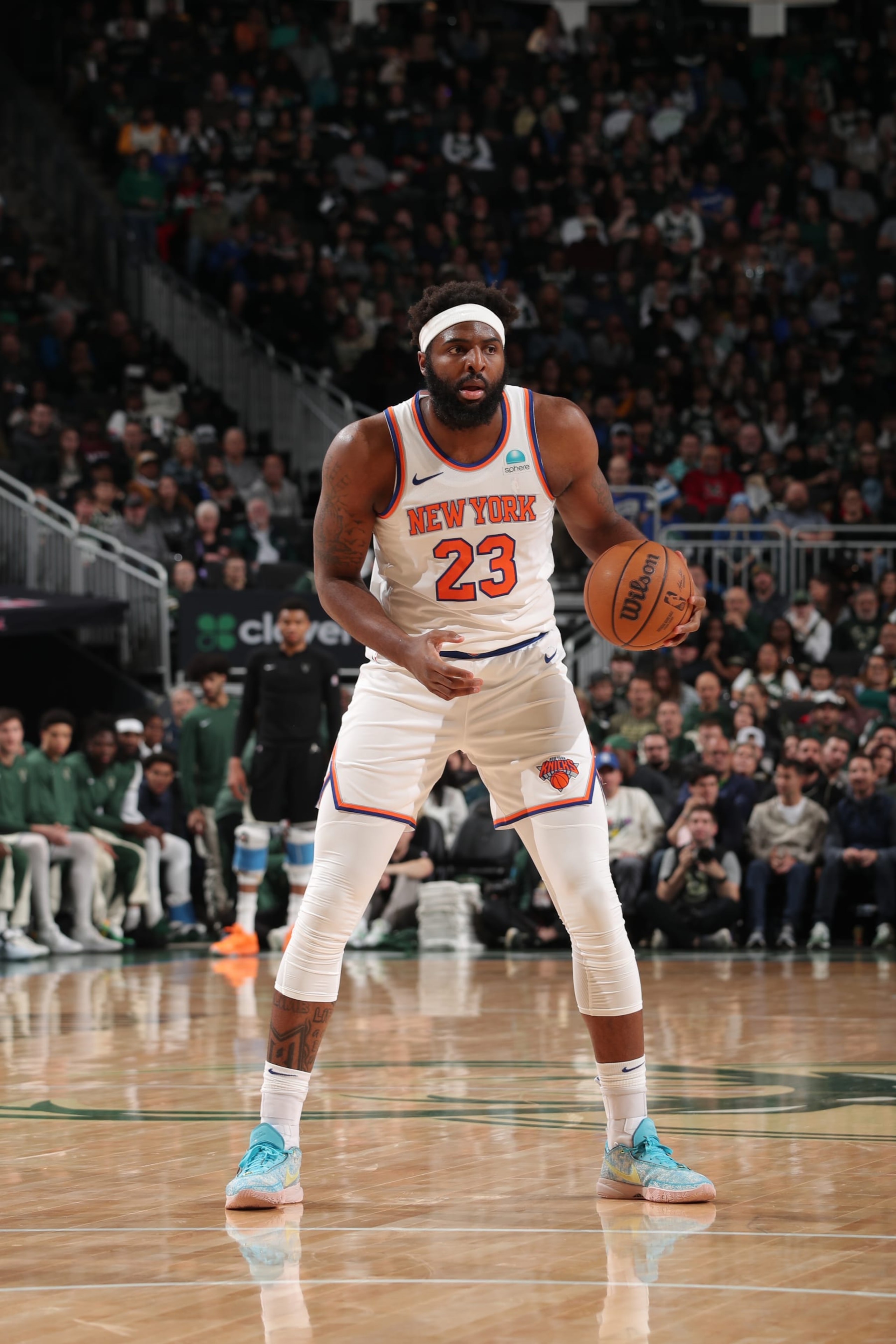 MILWAUKEE, WI - APRIL 7: Mitchell Robinson #23 of the New York Knicks handles the ball during the game against the Milwaukee Bucks on April 7, 2024 at the Fiserv Forum Center in Milwaukee, Wisconsin. NOTE TO USER: User expressly acknowledges and agrees that, by downloading and or using this Photograph, user is consenting to the terms and conditions of the Getty Images License Agreement. Mandatory Copyright Notice: Copyright 2024 NBAE (Photo by Gary Dineen/NBAE via Getty Images).