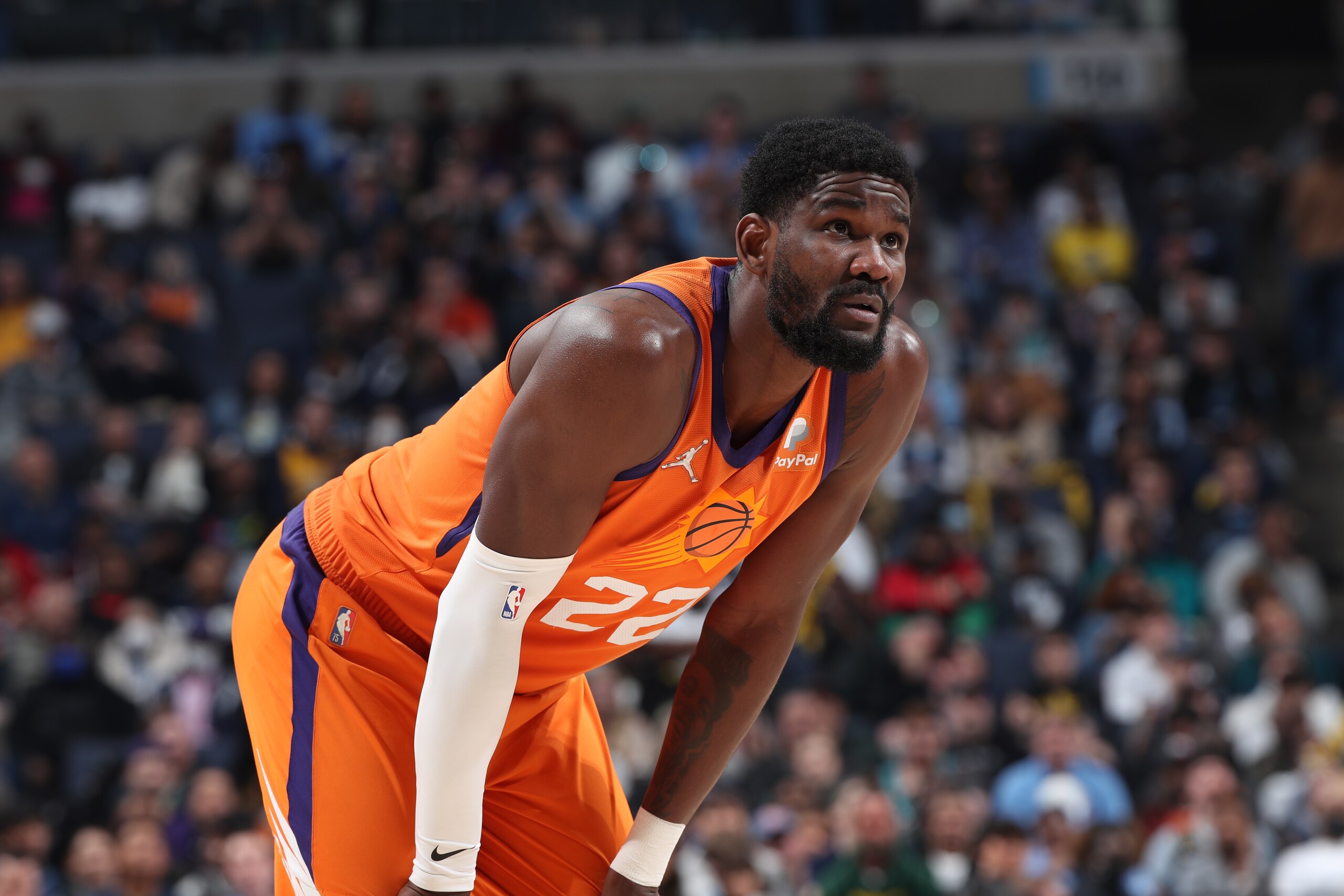MEMPHIS, TN - APRIL 1: Deandre Ayton #22 of the Phoenix Suns looks on during the game against the Memphis Grizzlies on April 1, 2022 at FedExForum in Memphis, Tennessee. NOTE TO USER: User expressly acknowledges and agrees that, by downloading and or using this photograph, User is consenting to the terms and conditions of the Getty Images License Agreement. Mandatory Copyright Notice: Copyright 2022 NBAE (Photo by Joe Murphy/NBAE via Getty Images)