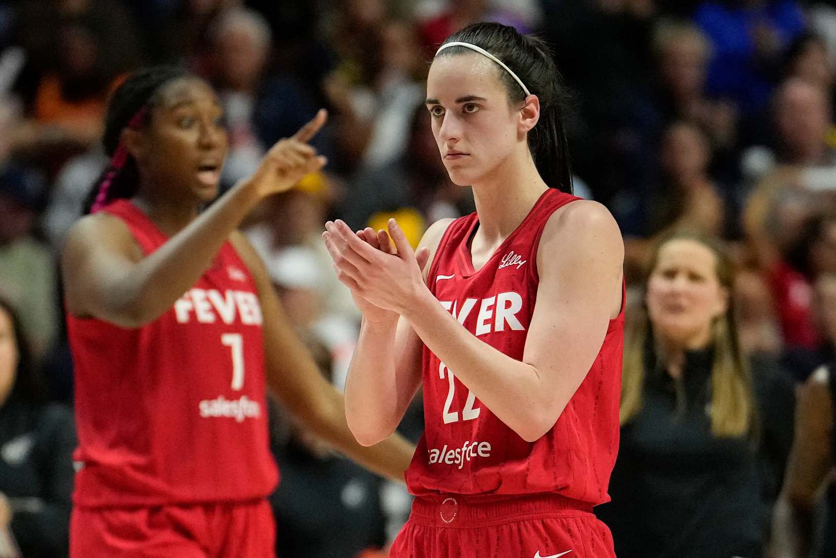 UNCASVILLE, CONNECTICUT - SEPTEMBER 25:  Aliyah Boston #7 and Caitlin Clark #22 of the Indiana Fever reacts as they play the Connecticut Sun during the fourth quarter of Game Two of the 2024 WNBA Playoffs first round at Mohegan Sun Arena on September 25, 2024 in Uncasville, Connecticut. (Photo by Joe Buglewicz/Getty Images)
