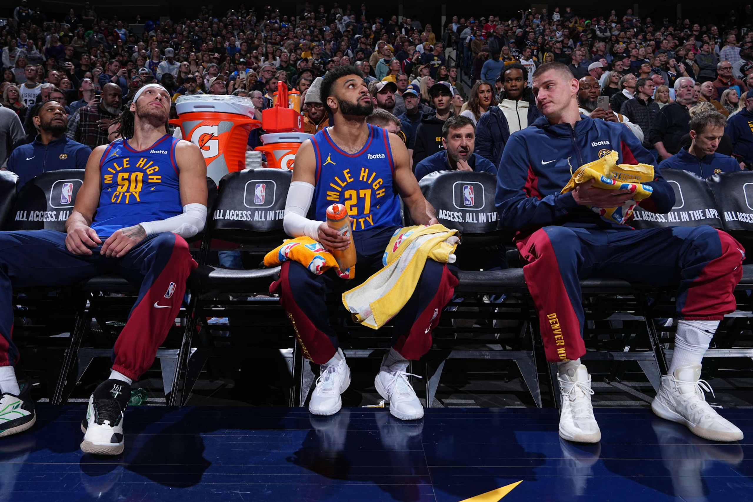 DENVER, CO - JANUARY 12: Aaron Gordon #50 of the Denver Nuggets, Jamal Murray #27 of the Denver Nuggets & Nikola Jokic #15 of the Denver Nuggets look on during the game on January 12, 2024 at the Ball Arena in Denver, Colorado. NOTE TO USER: User expressly acknowledges and agrees that, by downloading and/or using this Photograph, user is consenting to the terms and conditions of the Getty Images License Agreement. Mandatory Copyright Notice: Copyright 2024 NBAE (Photo by Garrett Ellwood/NBAE via Getty Images)