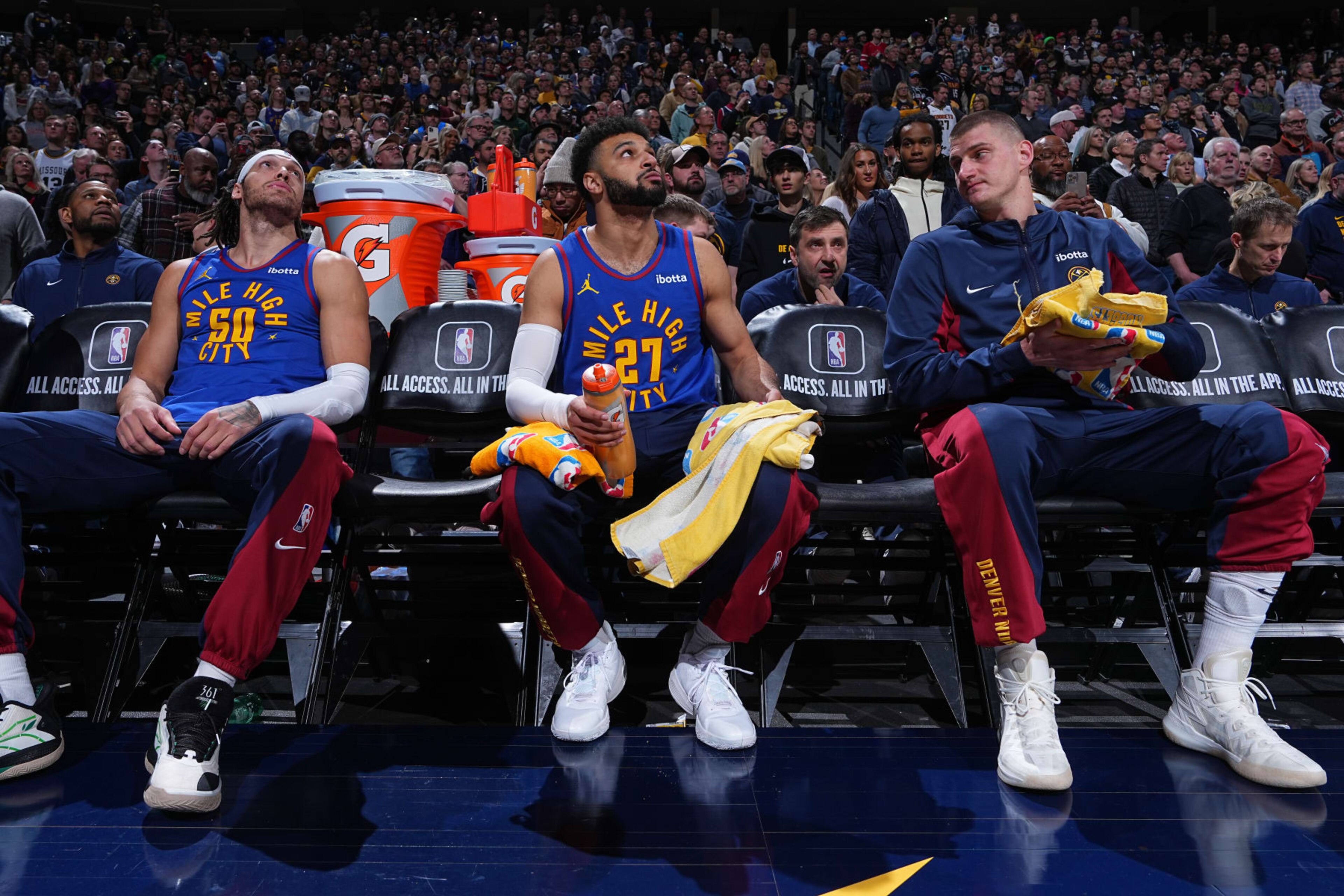 DENVER, CO - JANUARY 12: Aaron Gordon #50 of the Denver Nuggets, Jamal Murray #27 of the Denver Nuggets & Nikola Jokic #15 of the Denver Nuggets look on during the game on January 12, 2024 at the Ball Arena in Denver, Colorado. NOTE TO USER: User expressly acknowledges and agrees that, by downloading and/or using this Photograph, user is consenting to the terms and conditions of the Getty Images License Agreement. Mandatory Copyright Notice: Copyright 2024 NBAE (Photo by Garrett Ellwood/NBAE via Getty Images)
