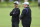 Baltimore Ravens head coach John Harbaugh, left, talks with offensive coordinator Greg Roman during drills at the NFL football team's practice facility, Thursday, June 16, 2022, in Owings Mills, Md. (AP Photo/Gail Burton)