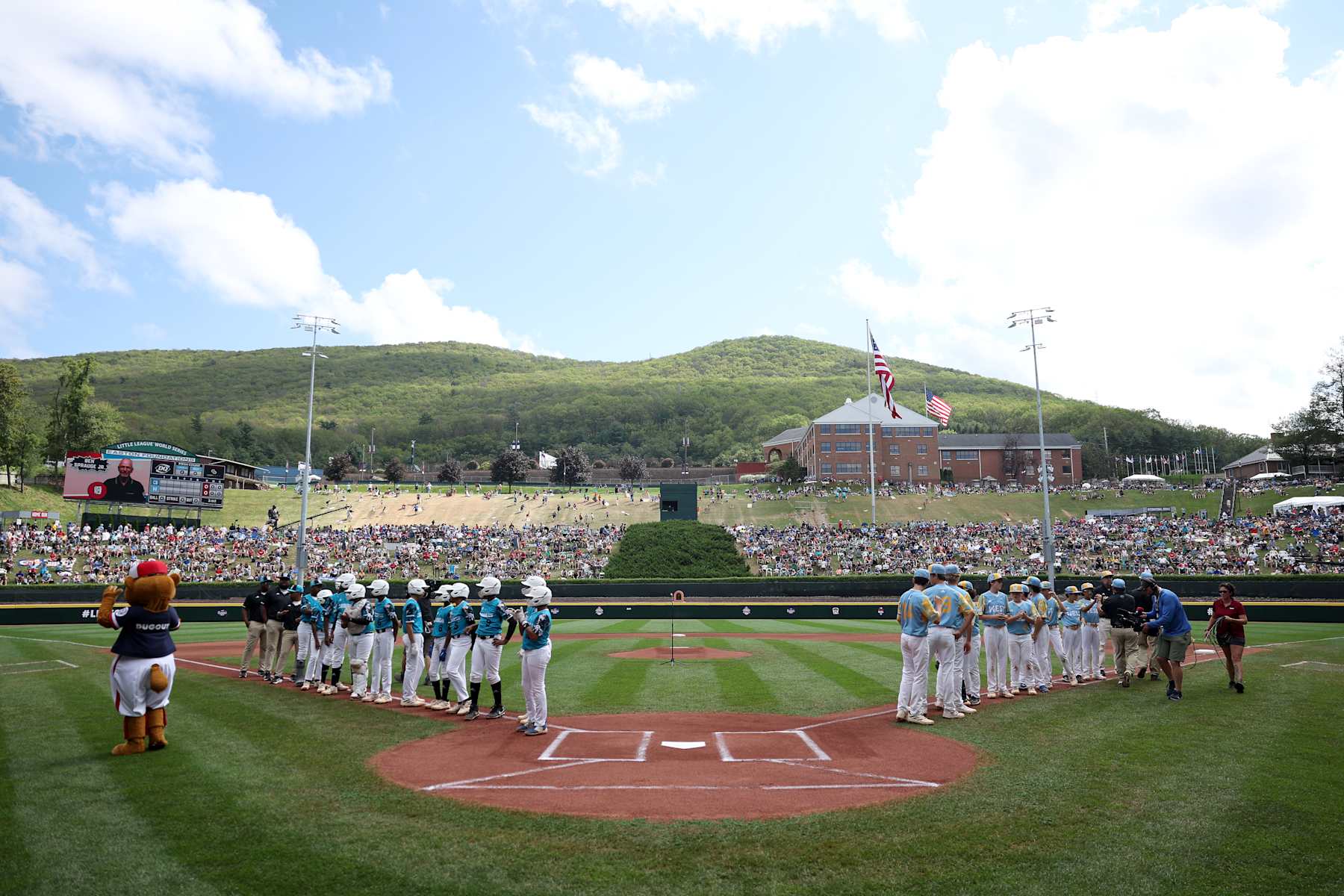 SOUTH WILLIAMSPORT, PENNSYLVANIA - AUGUST 27: Players of the West Region team from El Segundo, California and the Caribbean Region team from Willemstad, Curacao are announced during the Little League World Series Championship Game at Little League International Complex on August 27, 2023 in South Williamsport, Pennsylvania. (Photo by Tim Nwachukwu/Getty Images)