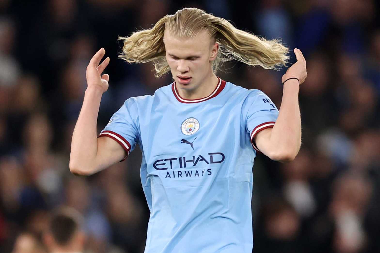 MANCHESTER, ENGLAND - APRIL 26: Erling Haaland of Manchester City flicks his hair during the Premier League match between Manchester City and Arsenal FC at Etihad Stadium on April 26, 2023 in Manchester, England. (Photo by Catherine Ivill/Getty Images)