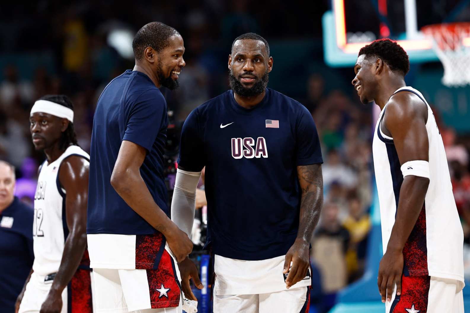 (From L) USA's #07 Kevin Durant, USA's #06 LeBron James and USA's #05 Anthony Edwards celebrate after winning the men's preliminary round group C basketball match between USA and South Sudan during the Paris 2024 Olympic Games at the Pierre-Mauroy stadium in Villeneuve-d'Ascq, northern France, on July 31, 2024. (Photo by Sameer Al-Doumy / AFP) (Photo by SAMEER AL-DOUMY/AFP via Getty Images)