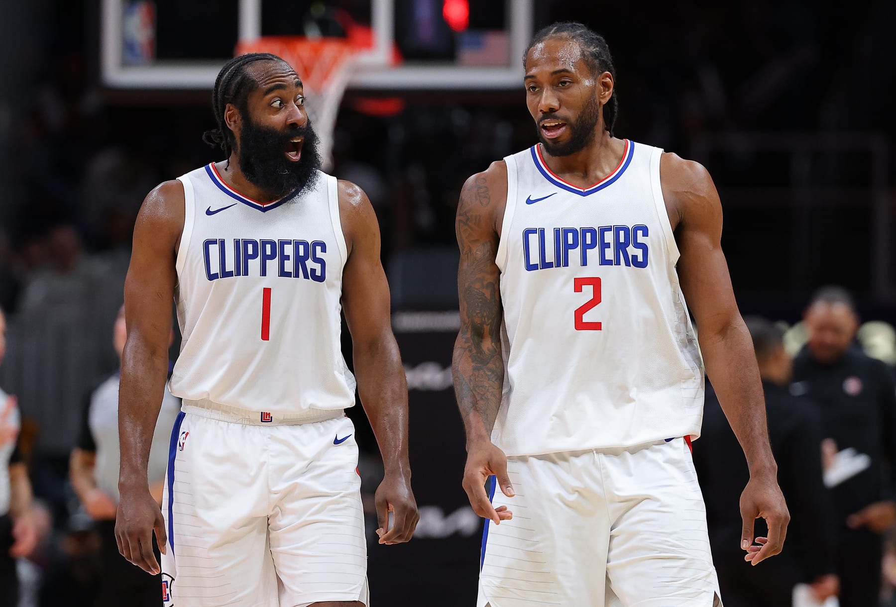 ATLANTA, GEORGIA - FEBRUARY 05:  James Harden #1 and Kawhi Leonard #2 of the LA Clippers converse during a timeout in the fourth quarter against the Atlanta Hawks at State Farm Arena on February 05, 2024 in Atlanta, Georgia.  NOTE TO USER: User expressly acknowledges and agrees that, by downloading and/or using this photograph, user is consenting to the terms and conditions of the Getty Images License Agreement.  (Photo by Kevin C. Cox/Getty Images)
