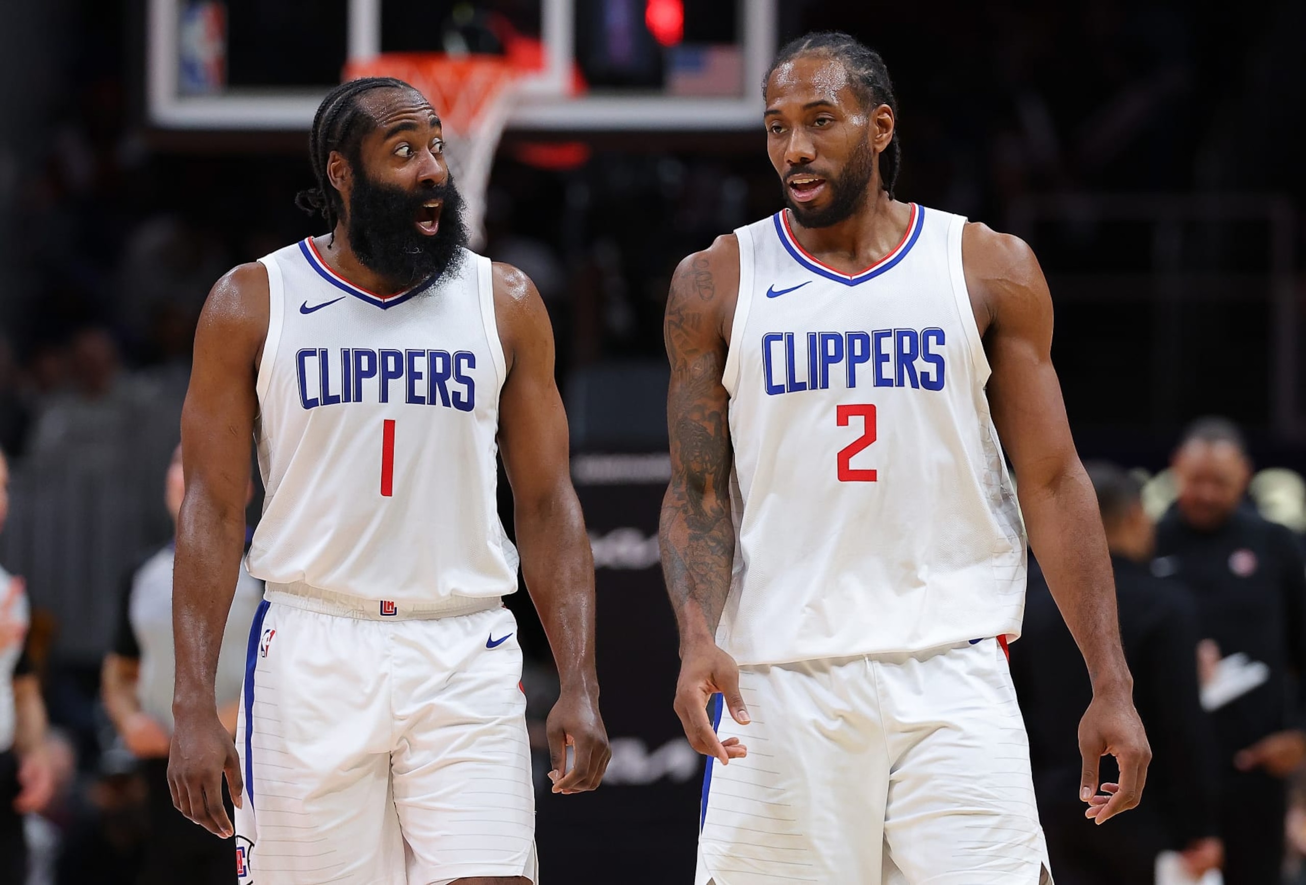ATLANTA, GEORGIA - FEBRUARY 05:  James Harden #1 and Kawhi Leonard #2 of the LA Clippers converse during a timeout in the fourth quarter against the Atlanta Hawks at State Farm Arena on February 05, 2024 in Atlanta, Georgia.  NOTE TO USER: User expressly acknowledges and agrees that, by downloading and/or using this photograph, user is consenting to the terms and conditions of the Getty Images License Agreement.  (Photo by Kevin C. Cox/Getty Images)