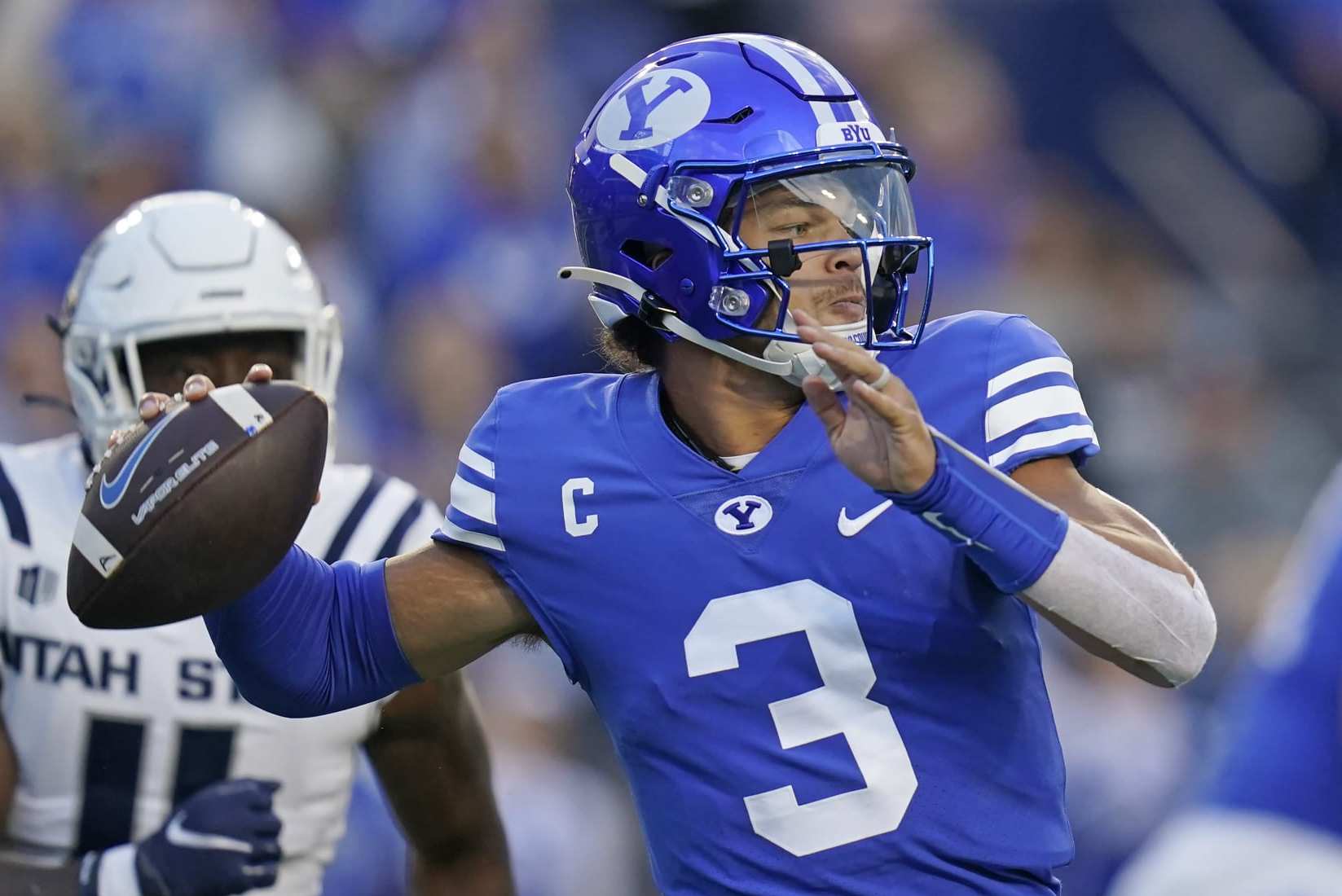 BYU quarterback Jaren Hall (3) throws a pass during the first half of the team's NCAA college football game against Utah State on Thursday, Sept. 29, 2022, in Provo, Utah. (AP Photo/Rick Bowmer)