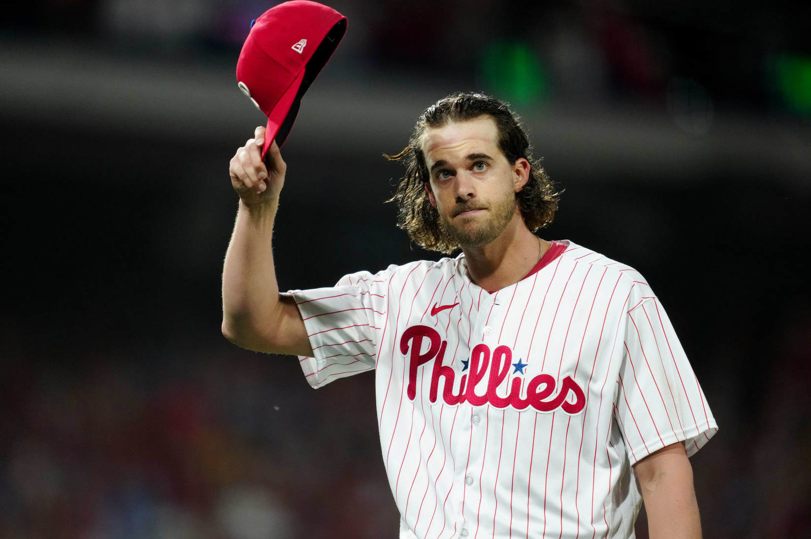 PHILADELPHIA, PA - OCTOBER 11: Aaron Nola #27 of the Philadelphia Phillies acknowledges the crowd as he walks back to the dugout during a pitching change during Game 3 of the Division Series between the Atlanta Braves and the Philadelphia Phillies at Citizens Bank Park on Wednesday, October 11, 2023 in Philadelphia, Pennsylvania. (Photo by Mary DeCicco/MLB Photos via Getty Images)