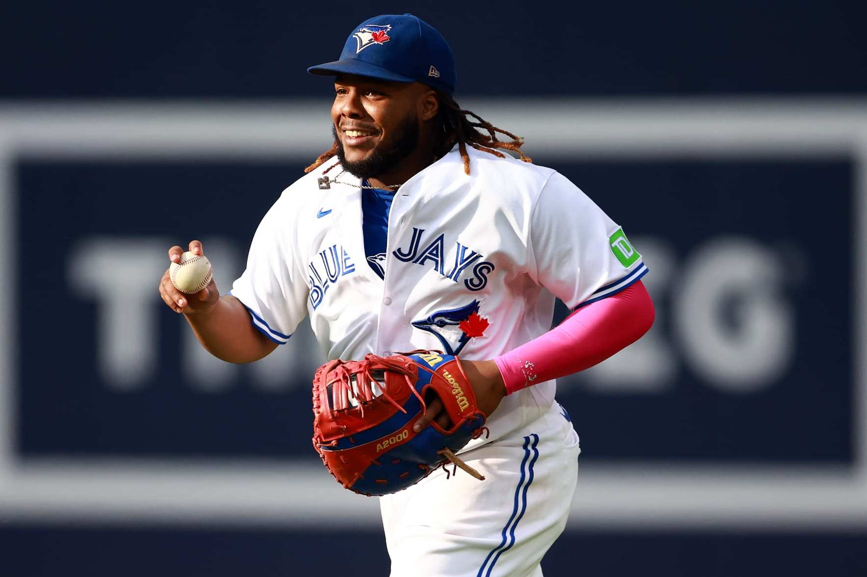 TORONTO, ON - SEPTEMBER 16:  Vladimir Guerrero Jr. #27 of the Toronto Blue Jays reacts after catching Justin Turner #2 of the Boston Red Sox out in the seventh inning at Rogers Centre on September 16, 2023 in Toronto, Ontario, Canada.  (Photo by Vaughn Ridley/Getty Images)