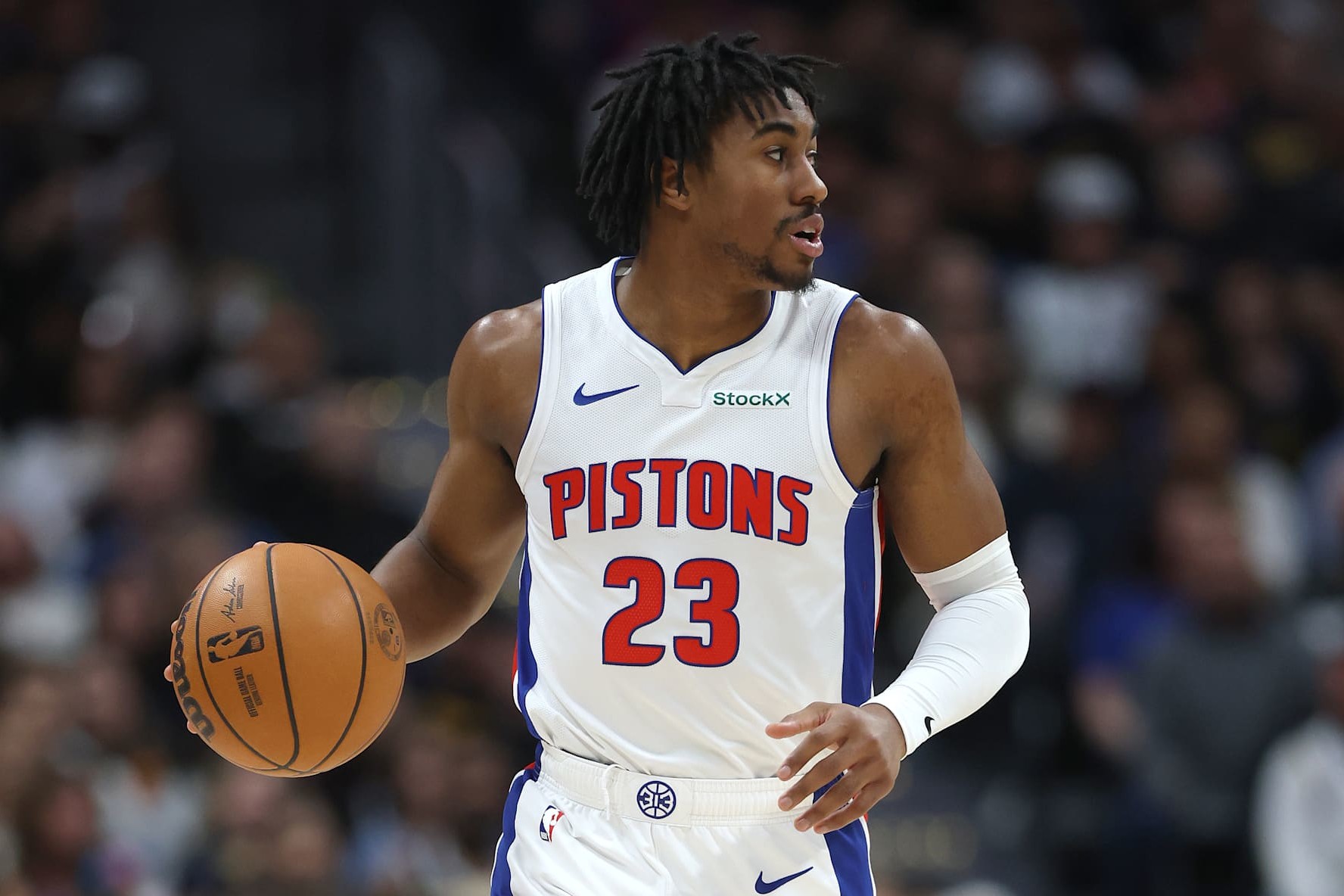 DENVER, COLORADO - DECEMBER 28: Jaden Ivey #23 of the Detroit Piston brings the ball down the court against the Denver Nuggets in the first quarter at Ball Arena on December 28, 2024 in Denver, Colorado. NOTE TO USER: User expressly acknowledges and agrees that, by downloading and or using this photograph, User is consenting to the terms and conditions of the Getty Images License Agreement. (Photo by Matthew Stockman/Getty Images)