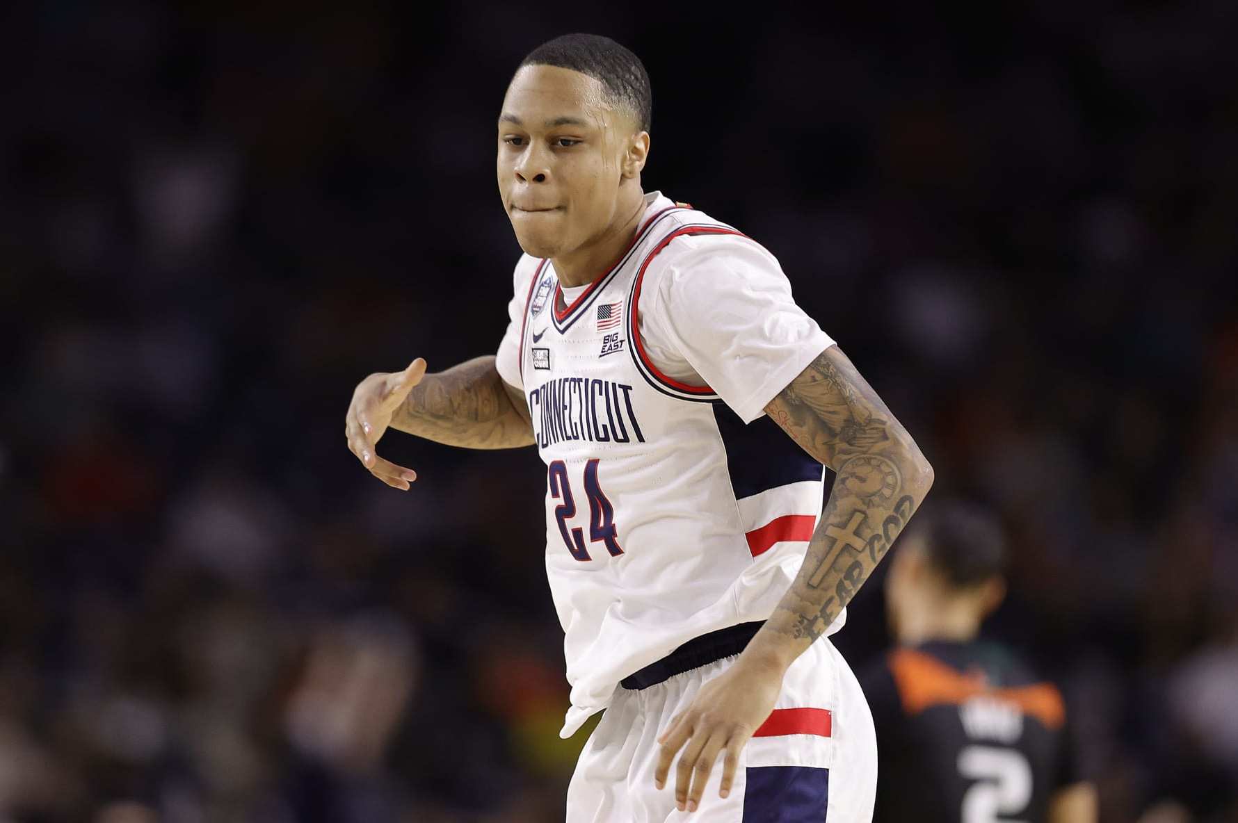 HOUSTON, TEXAS - APRIL 01: Jordan Hawkins #24 of the Connecticut Huskies reacts during the second half against the Miami Hurricanes during the NCAA Men's Basketball Tournament Final Four semifinal game at NRG Stadium on April 01, 2023 in Houston, Texas. (Photo by Carmen Mandato/Getty Images)