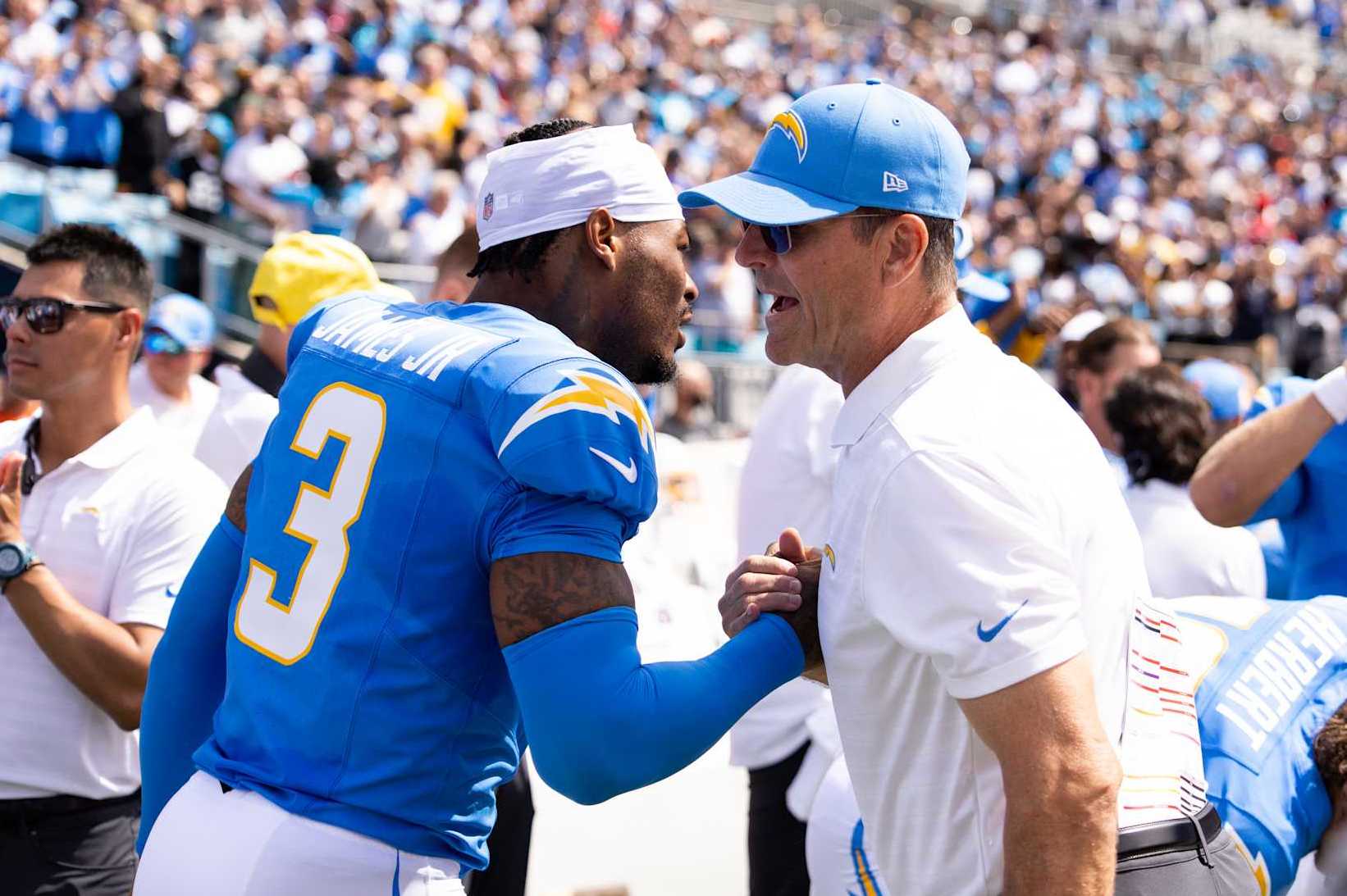 CHARLOTTE, NORTH CAROLINA - SEPTEMBER 15: Derwin James Jr. #3 of the Los Angeles Chargers greets head coach Jim Harbaugh before a game against the Carolina Panthers at Bank of America Stadium on September 15, 2024 in Charlotte, North Carolina. The Chargers defeated the Panthers 26-3. (Kara Durrette/Getty Images)