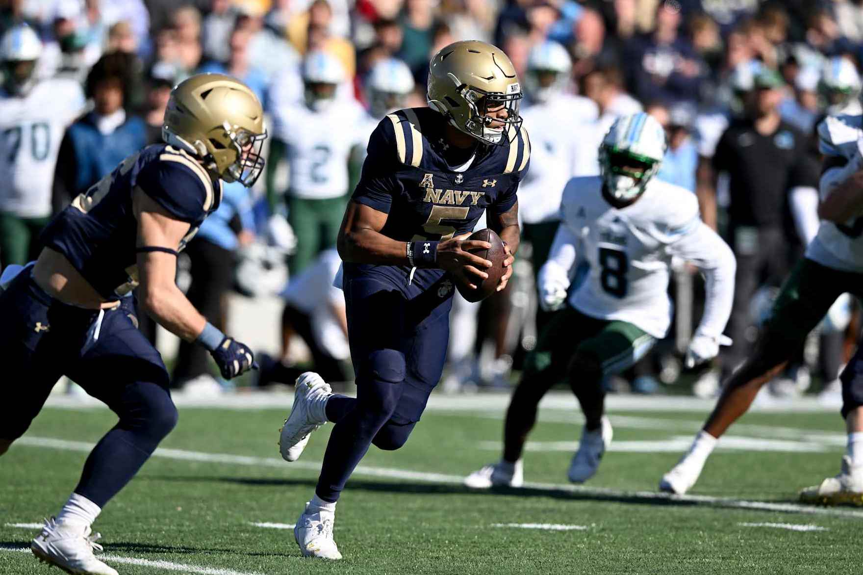 ANNAPOLIS, MARYLAND - NOVEMBER 16: Braxton Woodson #5 of the Navy Midshipmen runs with the ball in the second quarter against the Tulane Green Wave at Navy-Marine Corps Memorial Stadium on November 16, 2024 in Annapolis, Maryland. (Photo by G Fiume/Getty Images)
