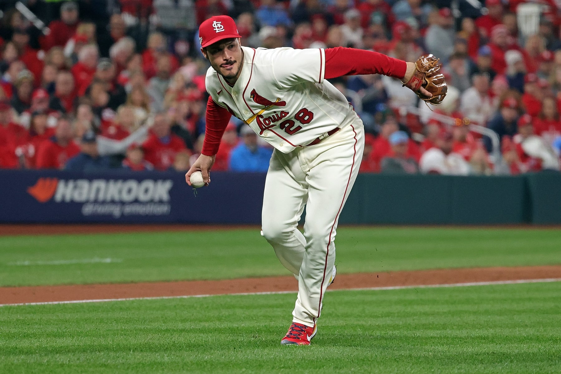 ST LOUIS, MISSOURI - OCTOBER 08: Nolan Arenado #28 of the St. Louis Cardinals fields a ground ball against the Philadelphia Phillies during game two of the National League Wild Card Series at Busch Stadium on October 08, 2022 in St Louis, Missouri. (Photo by Stacy Revere/Getty Images)