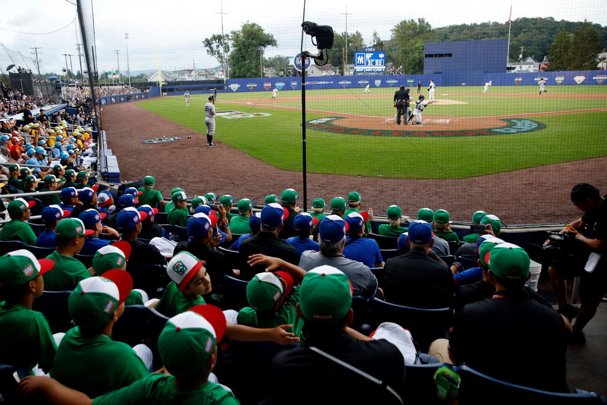 WILLIAMSPORT , PA - AUGUST 18:  Participants of the 2024 Little League World Series look on during the 2024 Little League Classic game between the New York Yankees and the Detroit Tigers at Journey Bank Ballpark at Historic Bowman Field on Sunday, August 18, 2024 in Williamsport , Pennsylvania. (Photo by Rob Tringali/MLB Photos via Getty Images)