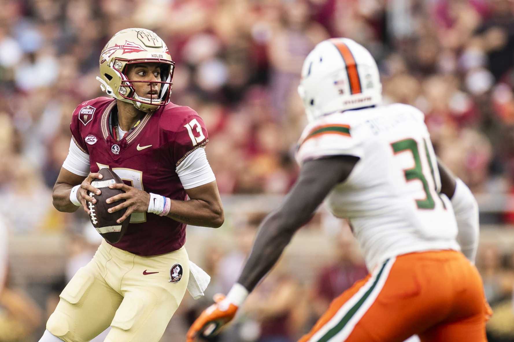 TALLAHASSEE, FLORIDA - NOVEMBER 11: Jordan Travis #13 of the Florida State Seminoles looks to pass during the first half of a game against the Miami Hurricanes at Doak Campbell Stadium on November 11, 2023 in Tallahassee, Florida. (Photo by James Gilbert/Getty Images)