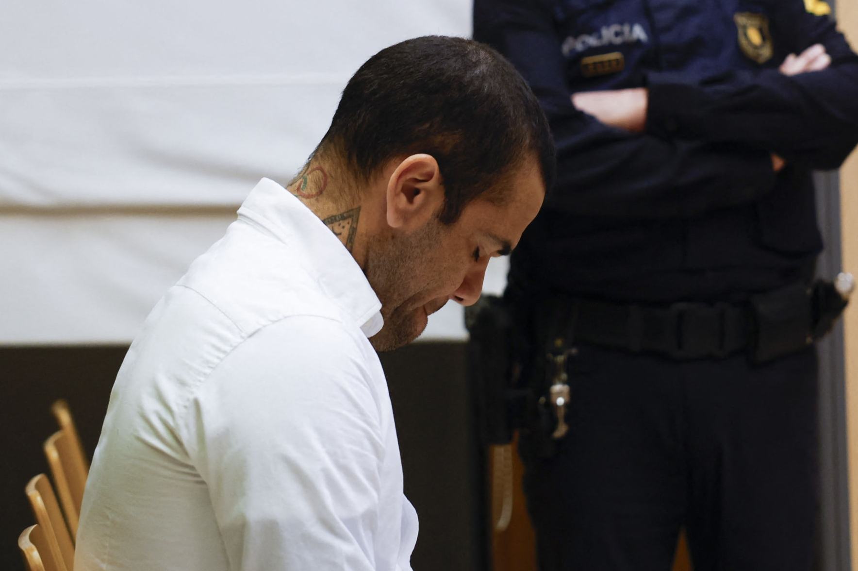Brazilian footballer Dani Alves reacts at the start of his trial at the High Court of Justice of Catalonia in Barcelona, on February 5, 2024. Brazilian footballer Dani Alves, a former star at Barca and PSG, goes on trial in Barcelona accused of raping a woman in a local nightclub. Prosecutors are asking for a nine-year prison sentence, followed by 10 years of conditional liberty. They are also asking he pay 150,000 euros ($162,000) in compensation to the woman. (Photo by Alberto Estevez and ALBERTO ESTÉVEZ / POOL / AFP) (Photo by ALBERTO ESTEVEZALBERTO ESTEVEZ/POOL/AFP via Getty Images)