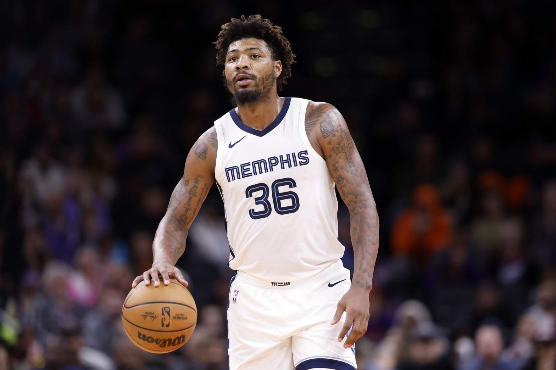 PHOENIX, ARIZONA - JANUARY 07: Marcus Smart #36 of the Memphis Grizzlies controls the ball during the game against the Phoenix Suns at Footprint Center on January 07, 2024 in Phoenix, Arizona. The Grizzlies defeated the Suns 121-115. NOTE TO USER: User expressly acknowledges and agrees that, by downloading and or using this photograph, User is consenting to the terms and conditions of the Getty Images License Agreement.  (Photo by Chris Coduto/Getty Images)