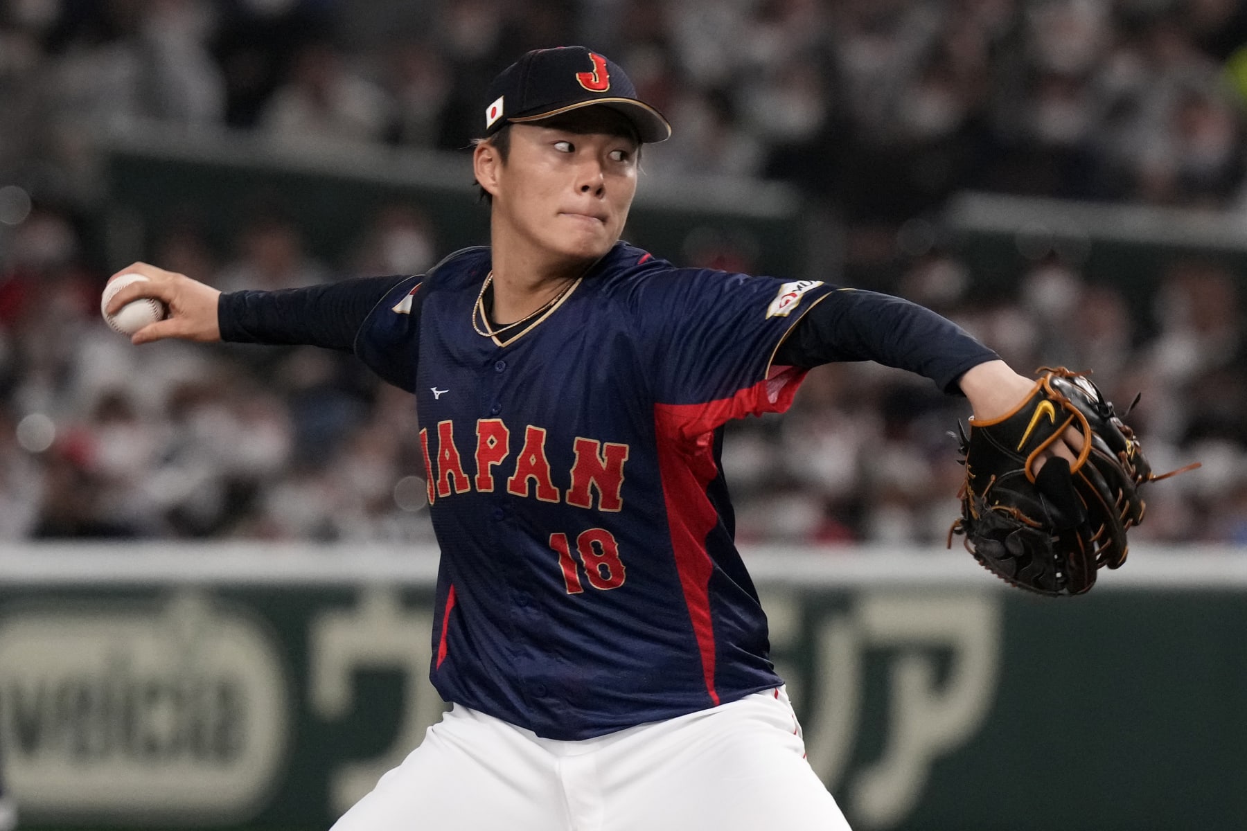 Yoshinobu Yamamoto of Japan pitches to Australia win the 1rst inning during their Pool B game at the World Baseball Classic at the Tokyo Dome Sunday, March 12, 2023, in Tokyo. (AP Photo/Eugene Hoshiko)