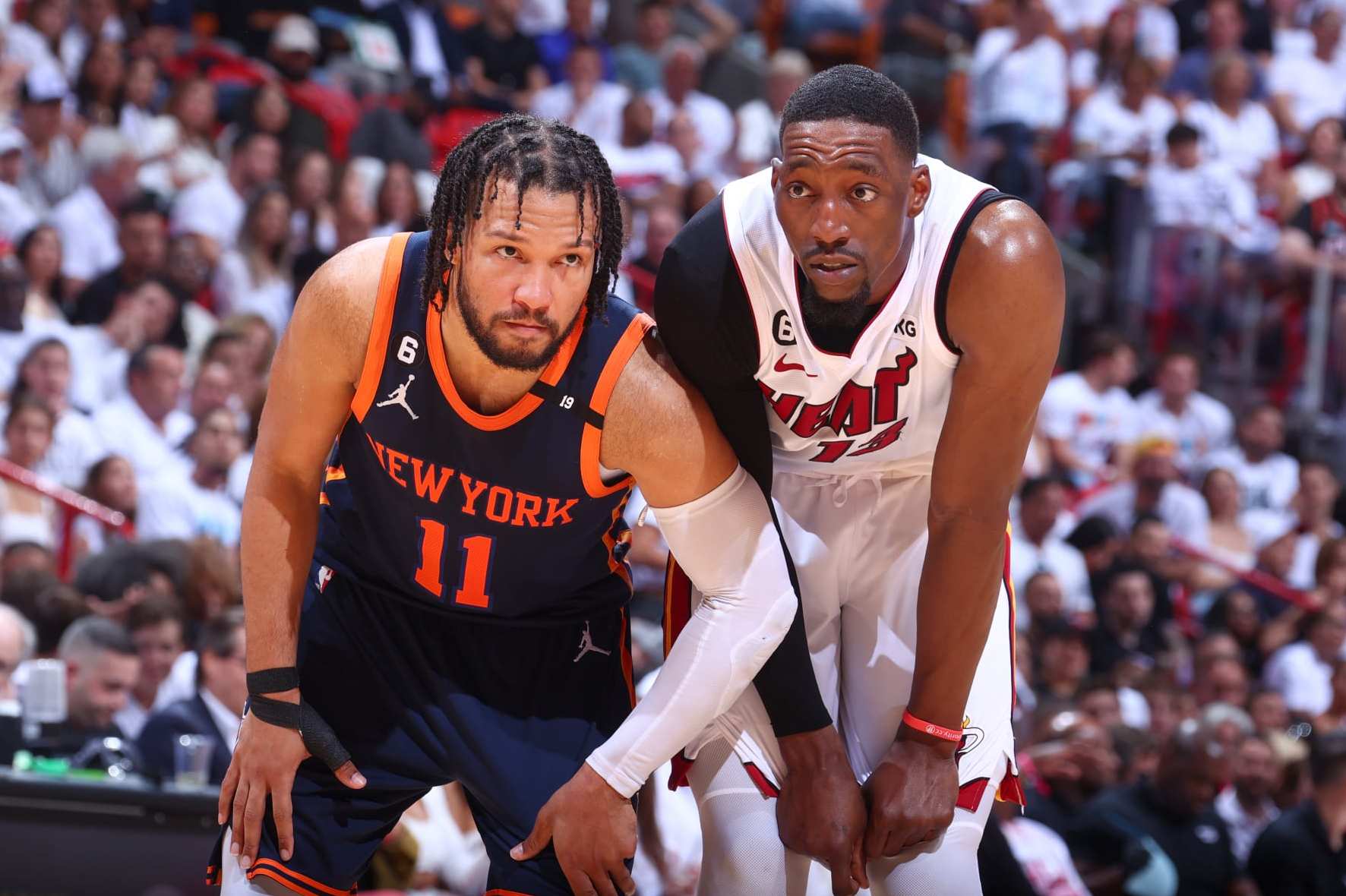MIAMI, FL - MAY 12: Jalen Brunson #11 of the New York Knicks and Bam Adebayo #13 of the Miami Heat look on during Game 6 of the 2023 NBA Playoffs Eastern Conference semi-finals on May 12, 2023 at Kaseya Center in Miami, Florida. NOTE TO USER: User expressly acknowledges and agrees that, by downloading and or using this Photograph, user is consenting to the terms and conditions of the Getty Images License Agreement. Mandatory Copyright Notice: Copyright 2023 NBAE (Photo by Nathaniel S. Butler/NBAE via Getty Images)