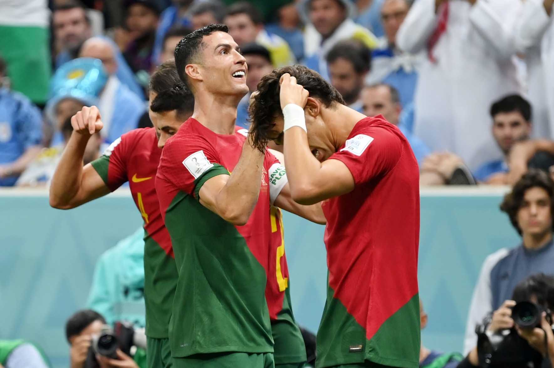 LUSAIL CITY, QATAR - NOVEMBER 28: Cristiano Ronaldo of Portugal celebrates with teammates after scoring their team's first goal during the FIFA World Cup Qatar 2022 Group H match between Portugal and Uruguay at Lusail Stadium on November 28, 2022 in Lusail City, Qatar. (Photo by Justin Setterfield/Getty Images)