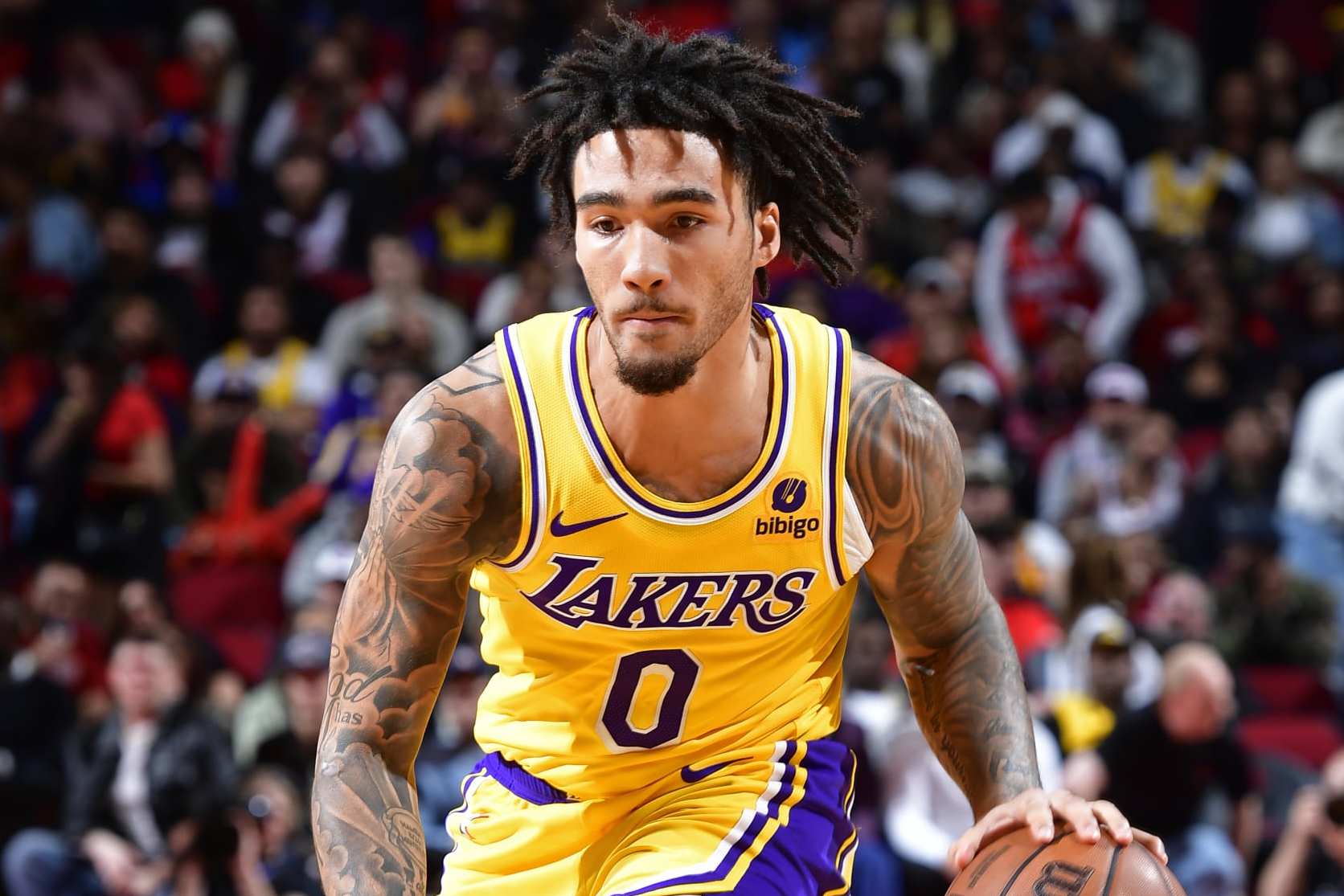 HOUSTON, TX - JANUARY 29: Jalen Hood-Schifino #0 of the Los Angeles Lakers dribbles the ball during the game against the Houston Rockets on January 29, 2024 at the Toyota Center in Houston, Texas. NOTE TO USER: User expressly acknowledges and agrees that, by downloading and or using this photograph, User is consenting to the terms and conditions of the Getty Images License Agreement. Mandatory Copyright Notice: Copyright 2024 NBAE (Photo by Logan Riely/NBAE via Getty Images)